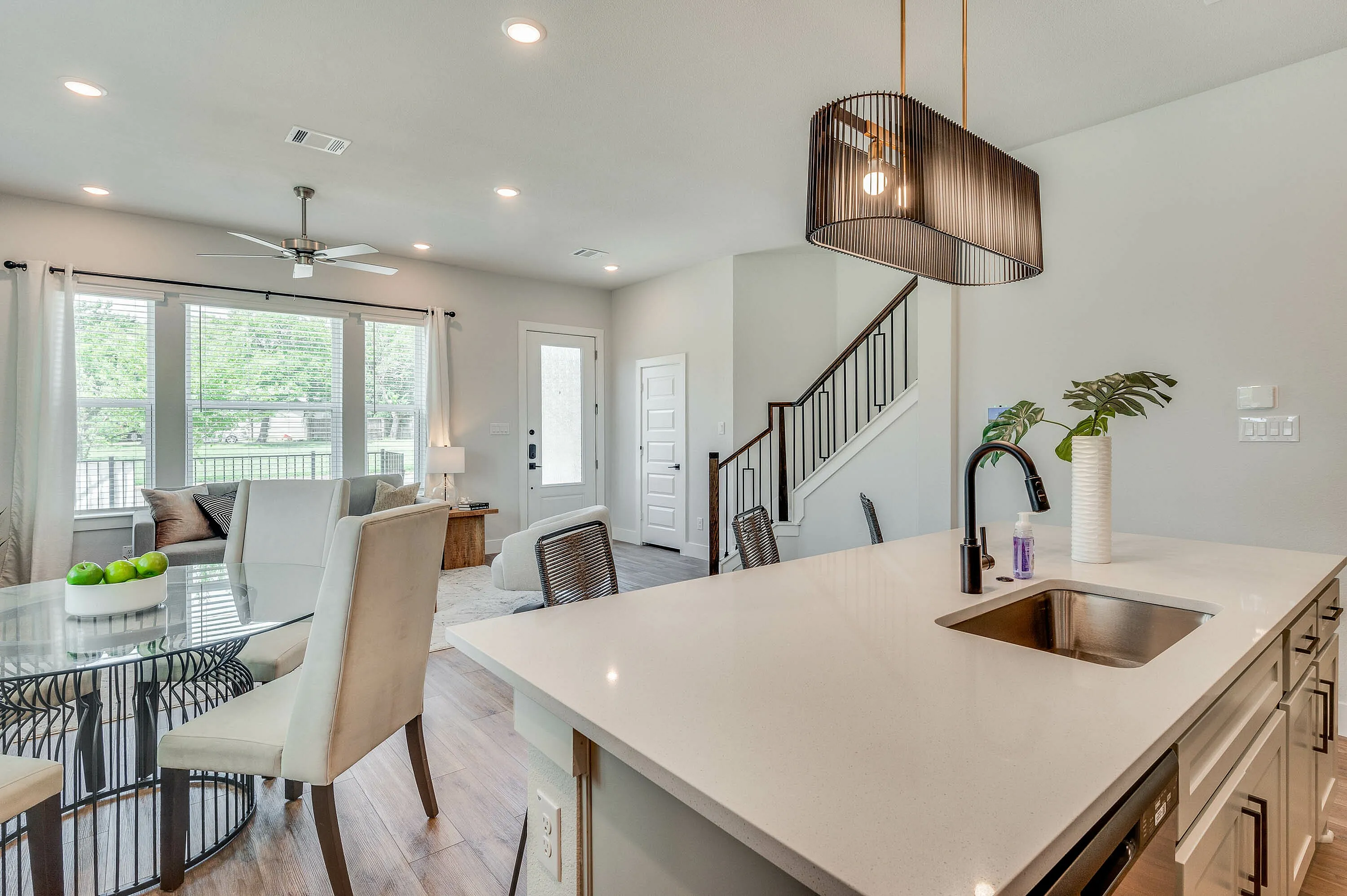 furnished and decorated living room and kitchen with wood style flooring