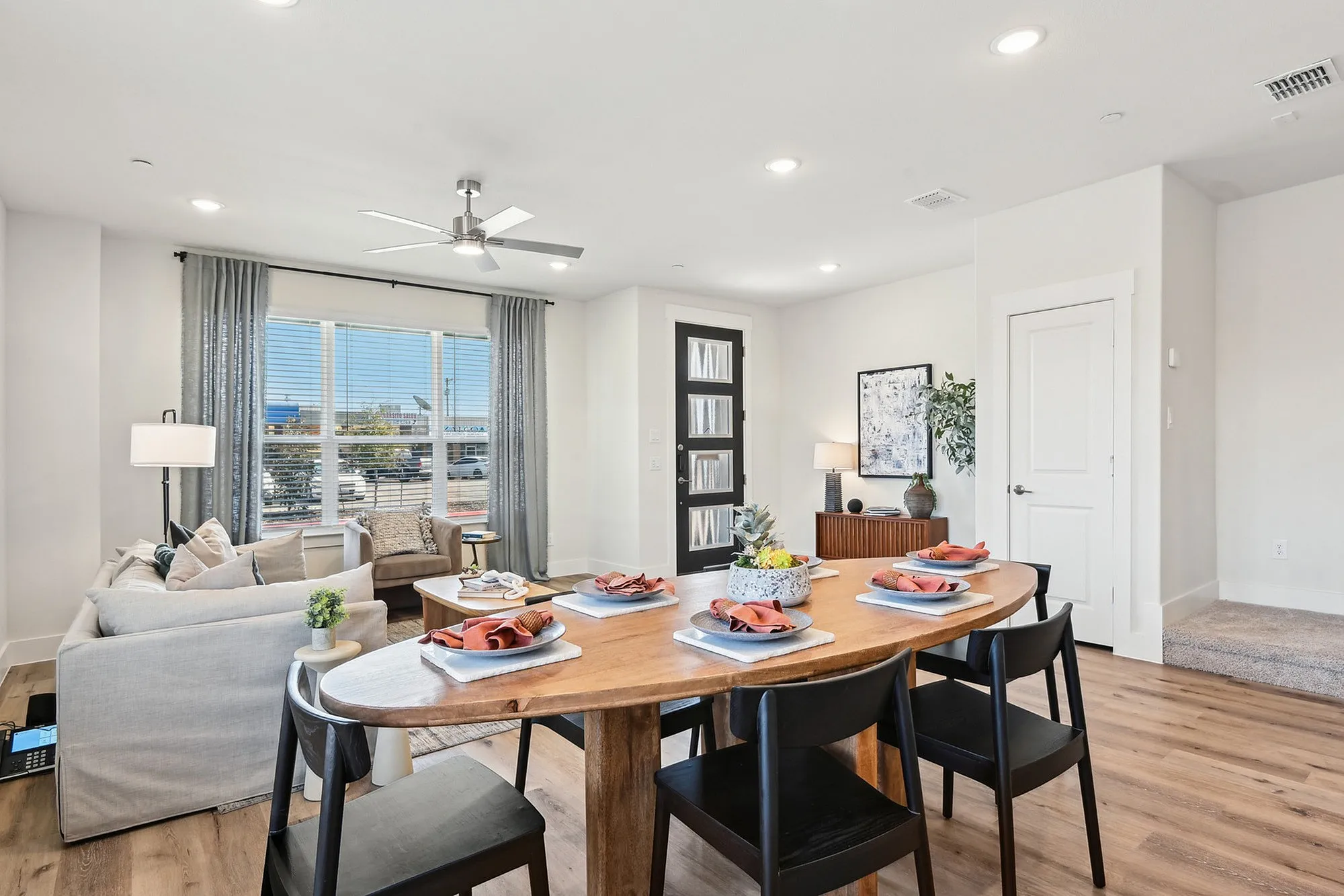 Furnished Dining area with dining table and chairs and view of the furnished living room