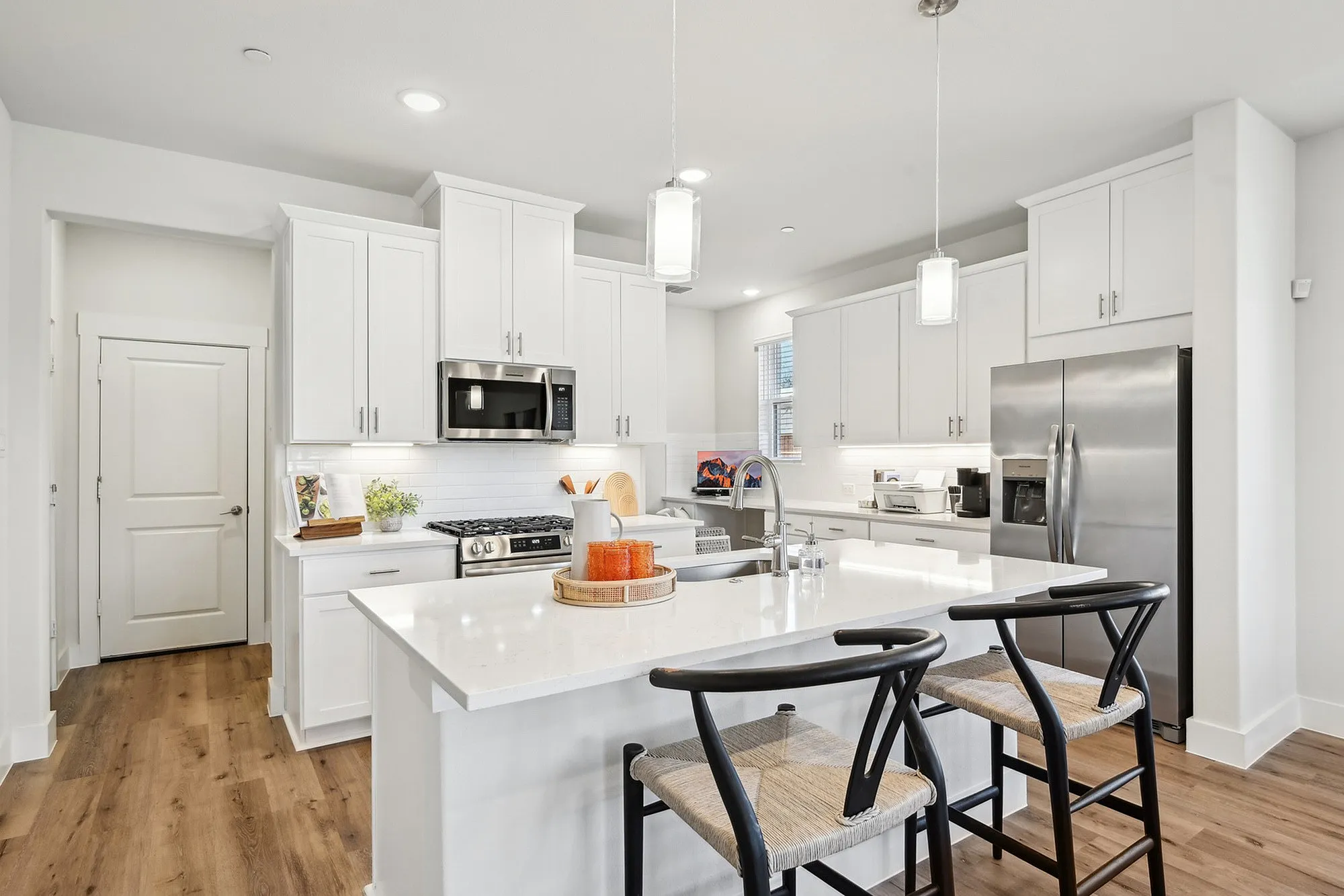 Kitchen  with white cabinets and stainless steel appliances with kitchen island