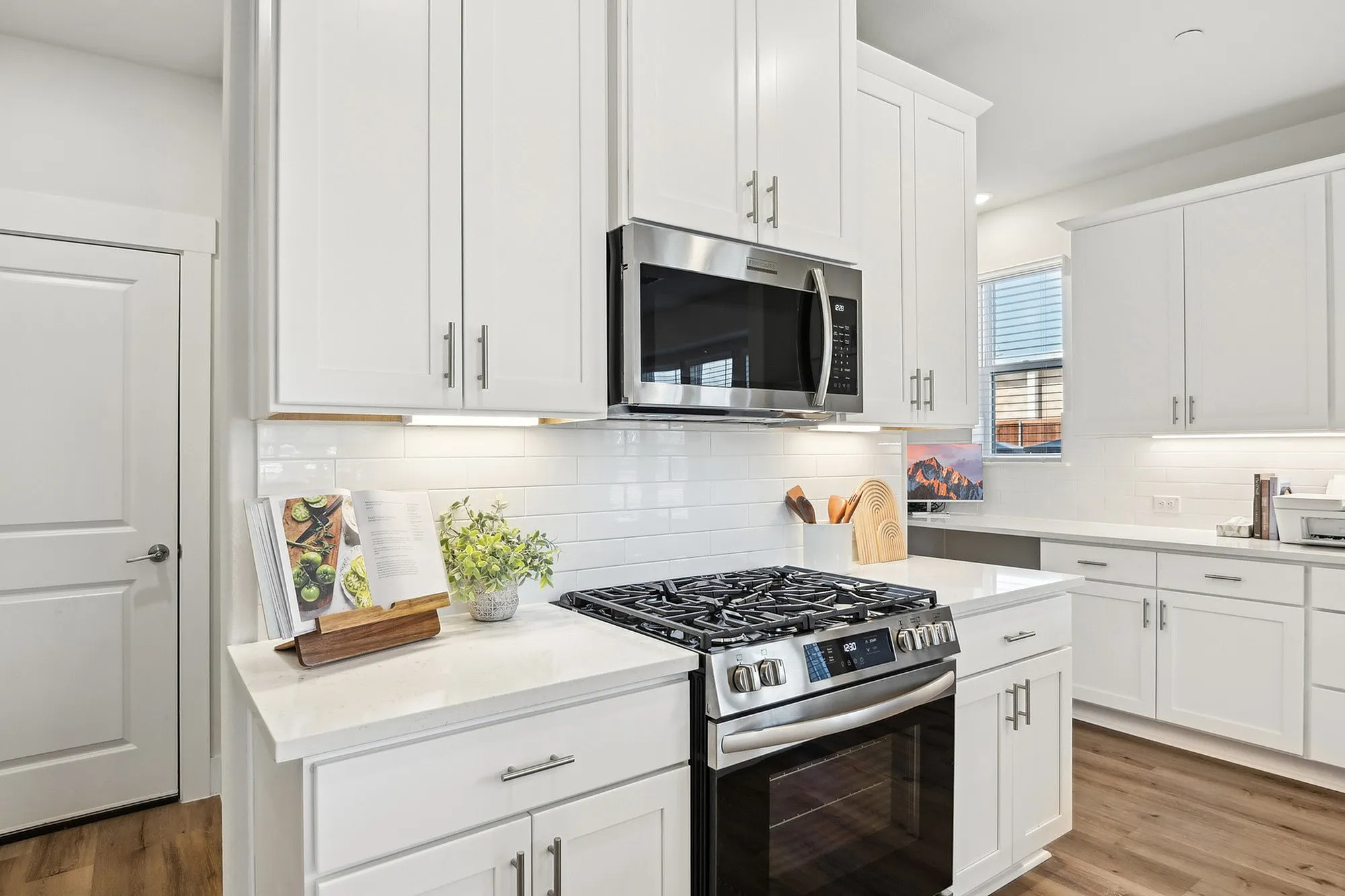 Kitchen with white cabinets and stainless steel appliances