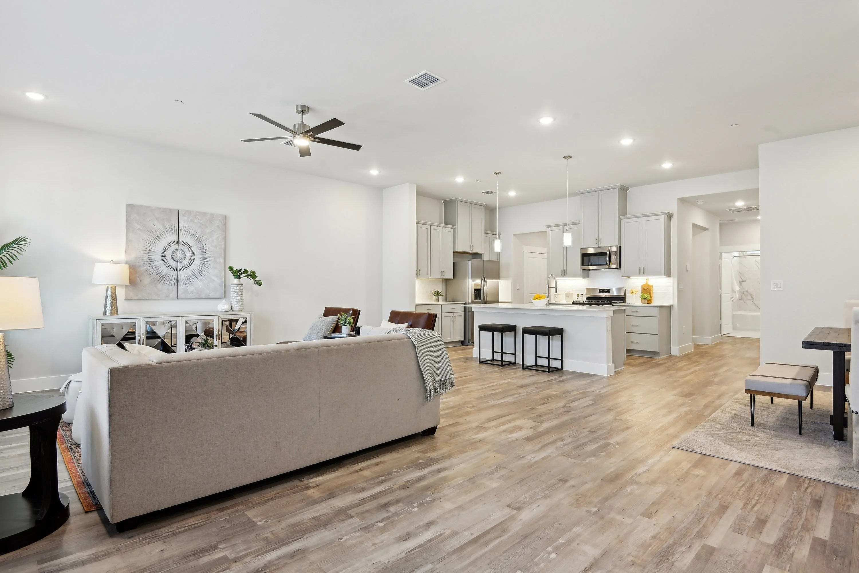living area with wood style flooring and tall ceilings