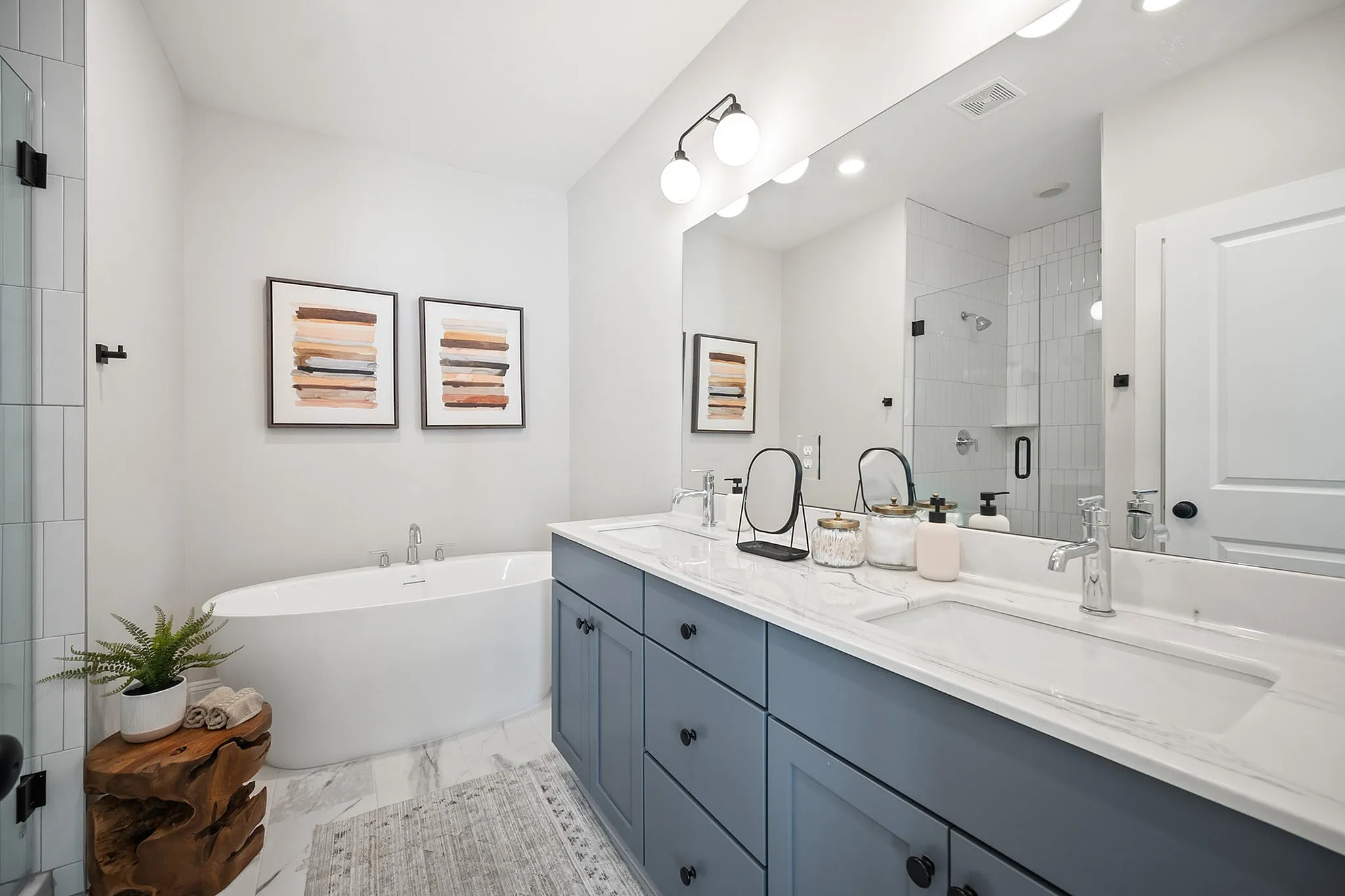 Primary bathroom with large soaking tub and double vanity
