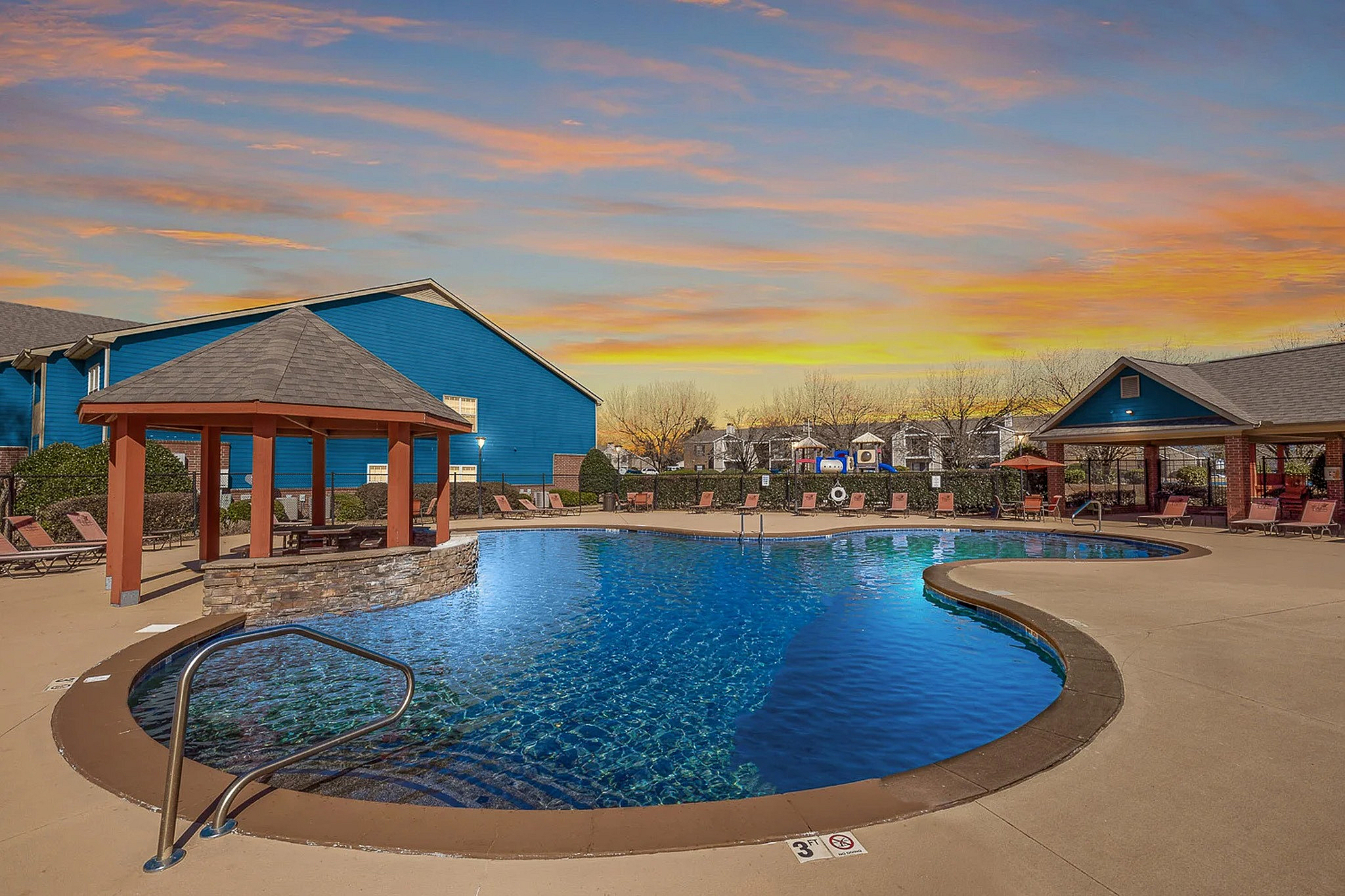 Sparkling swimming pool at sunset