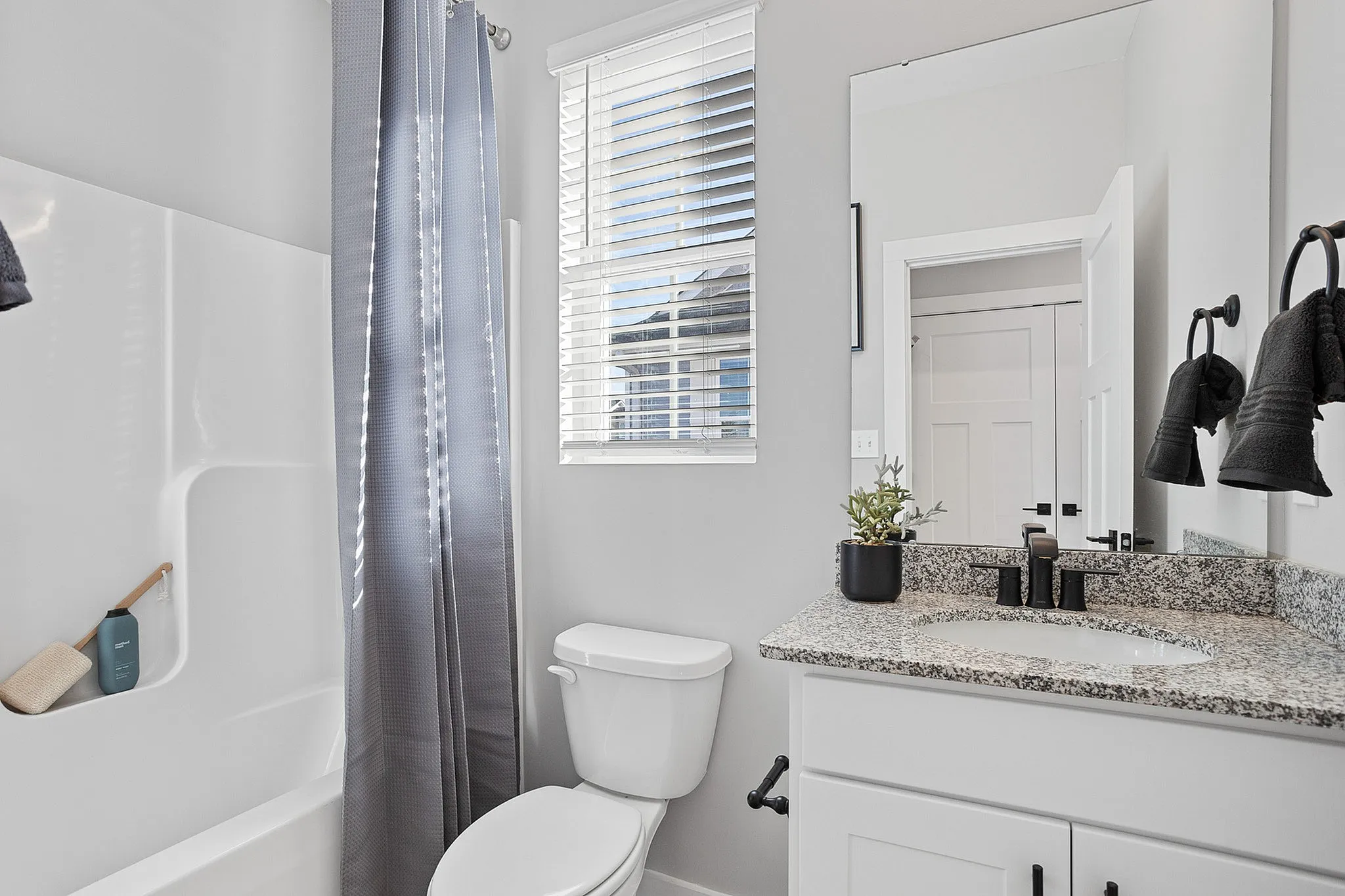 Furnished bathroom with tub/shower combo
