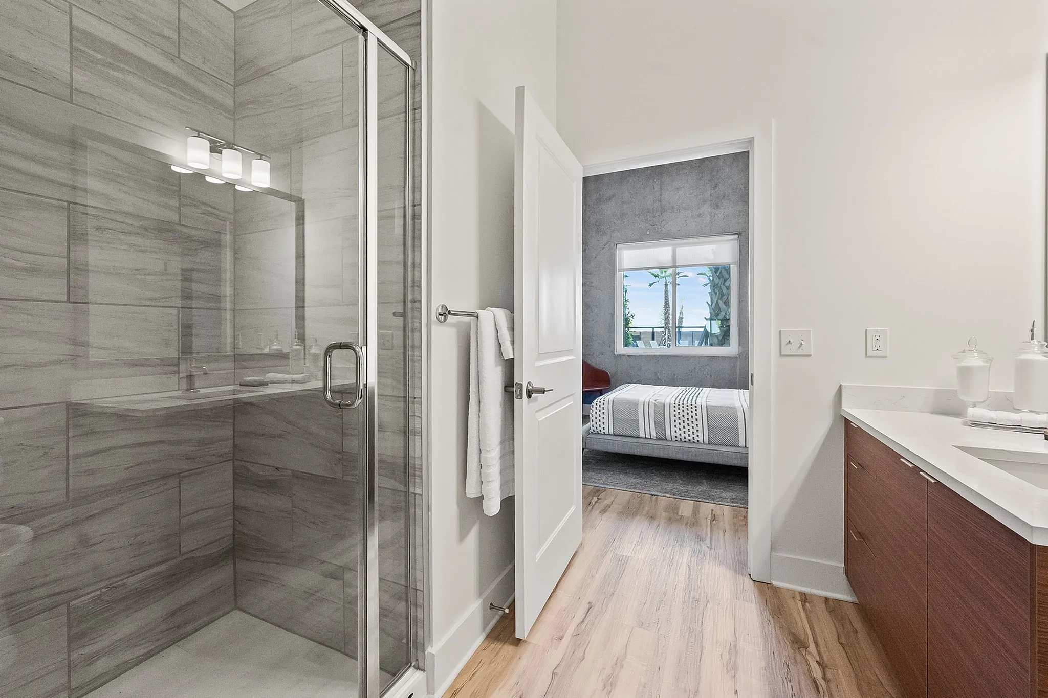1-Bedroom Luxury Apartments Viera FL - Luna At Viera - Upscale Bathroom Featuring A Spacious Shower With A Glass Shower Door And Accent Tile