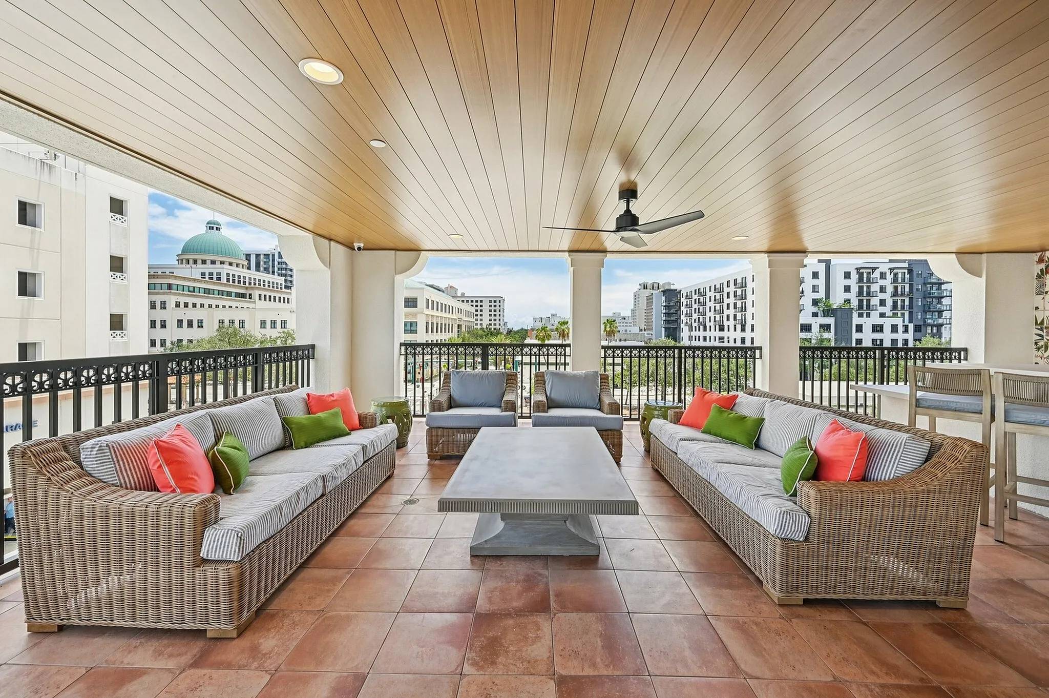 Outdoor lounging area with couches and tables