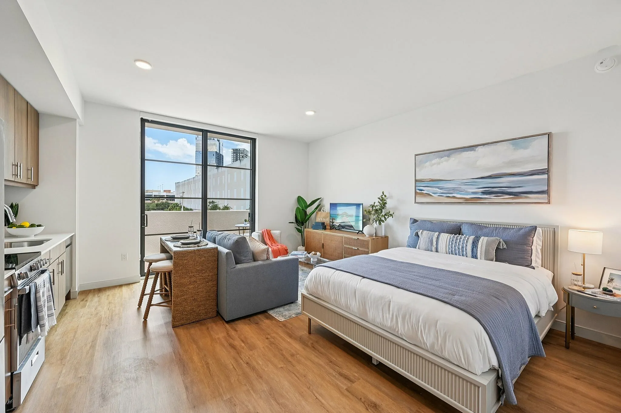 Studio with bed, living room and kitchen