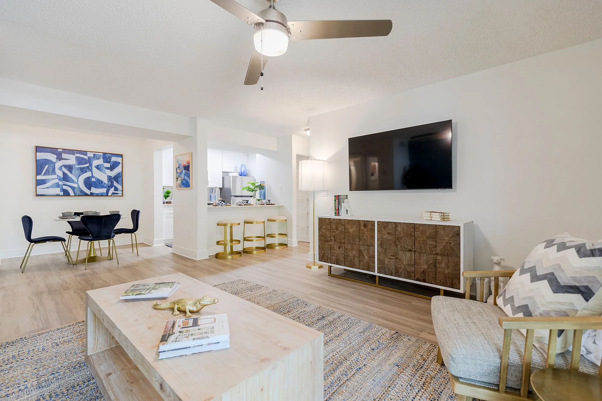 Furnished living room, dining room and kitchen