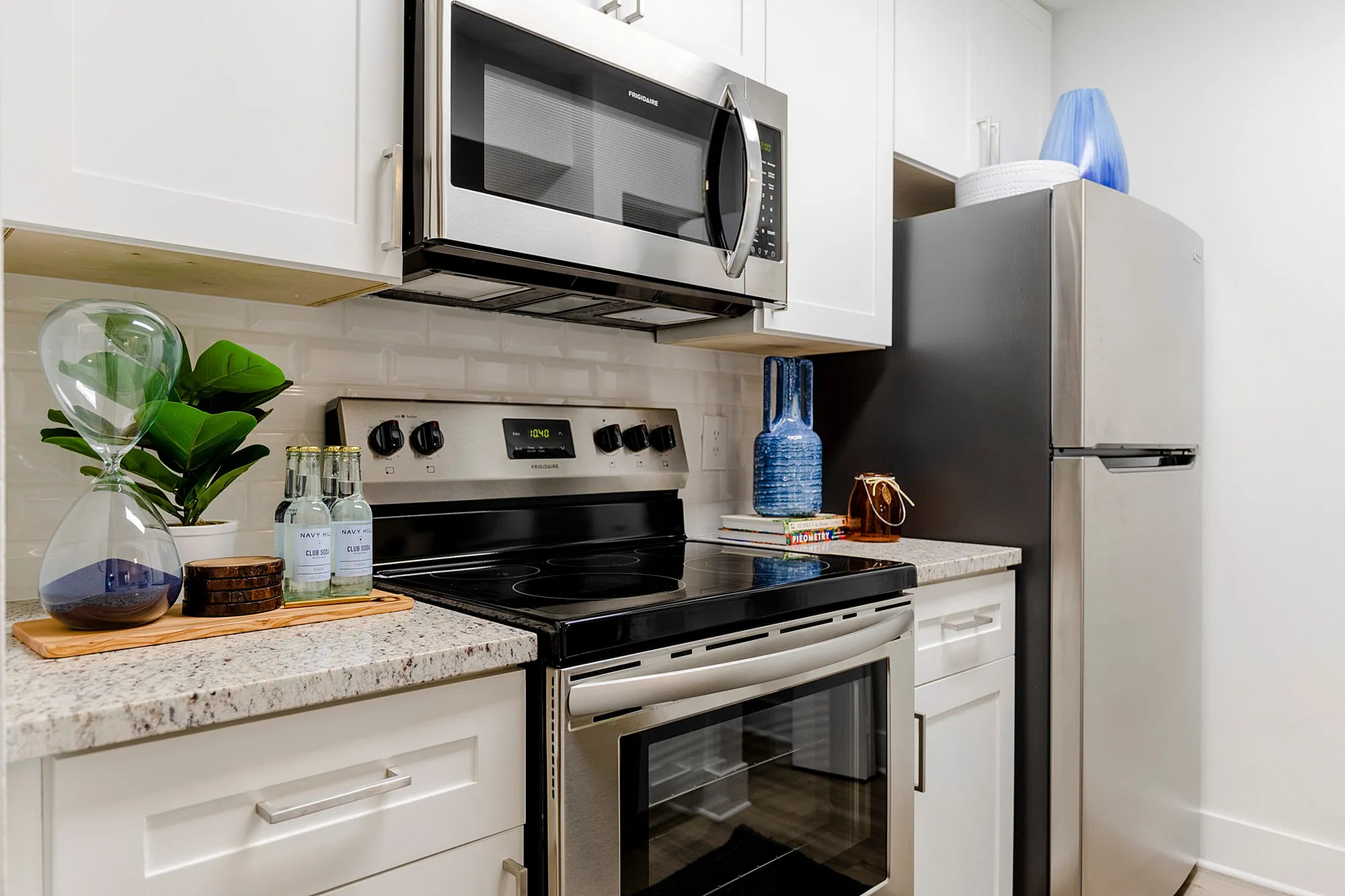Kitchen with white cabinets and stainless steel appliances