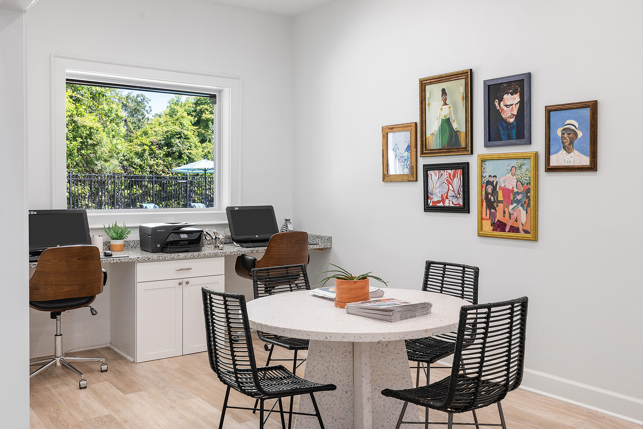 Business center with table and seats, printer and computers