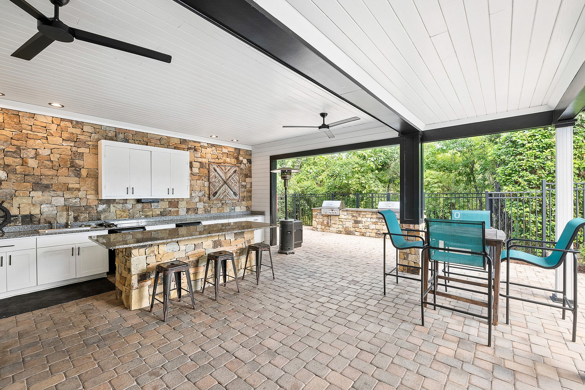 Sparkling swimming pool at Preserve at Port Royal with tables and chairs
