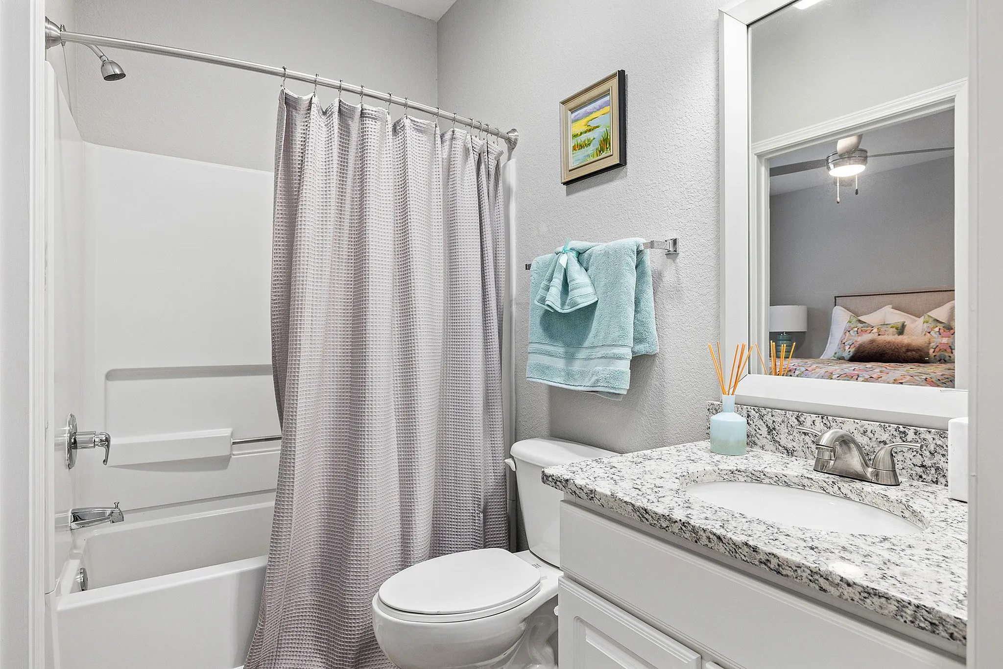 Bathroom with shower/tub combo and single vanity