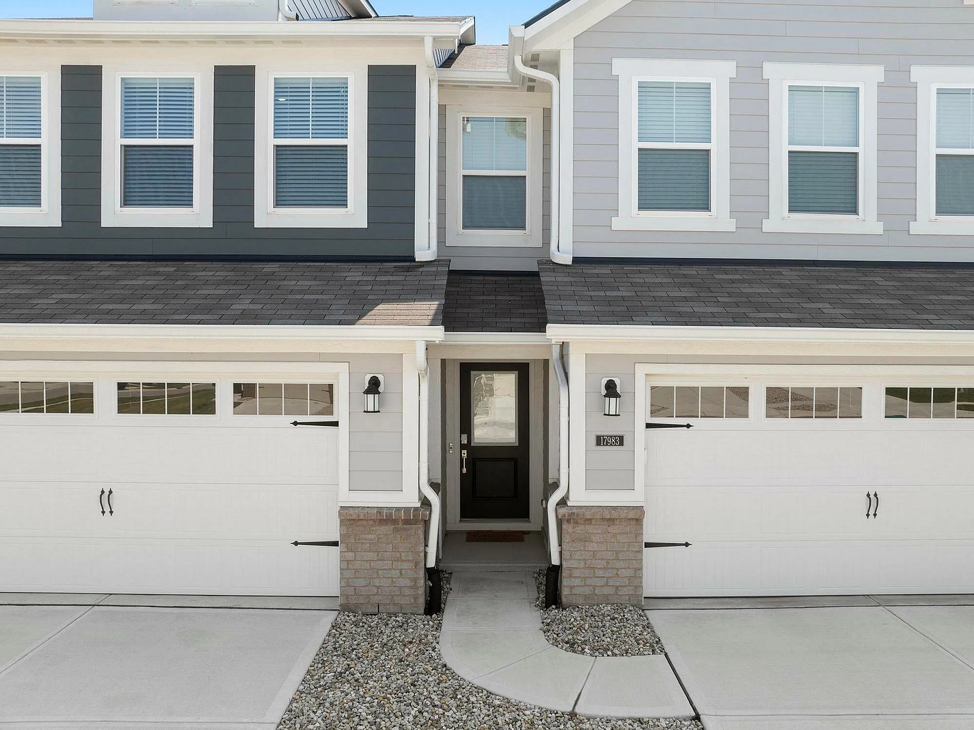 Front of townhomes with attached two car garages