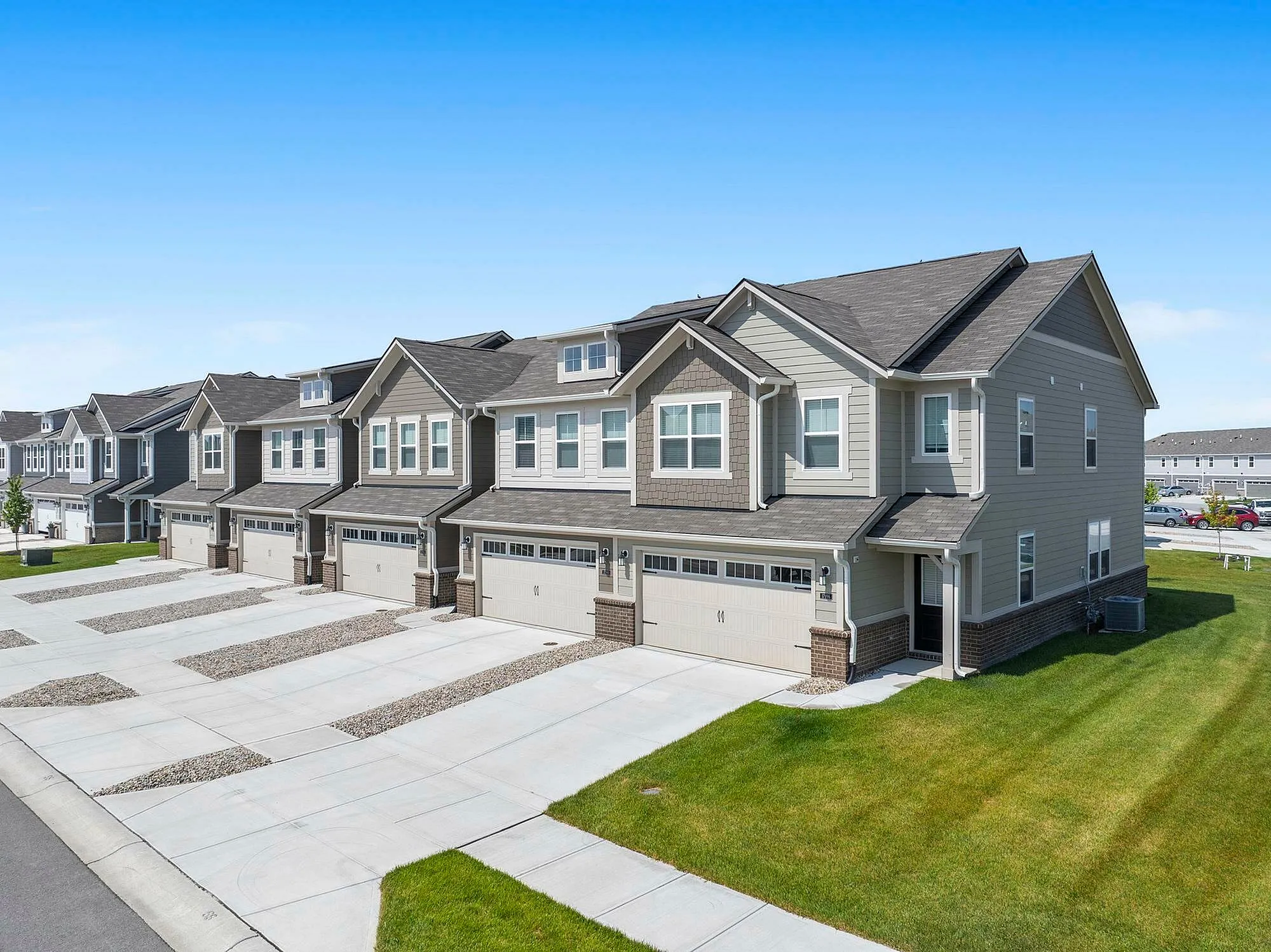 Front of townhomes with attached two car garages