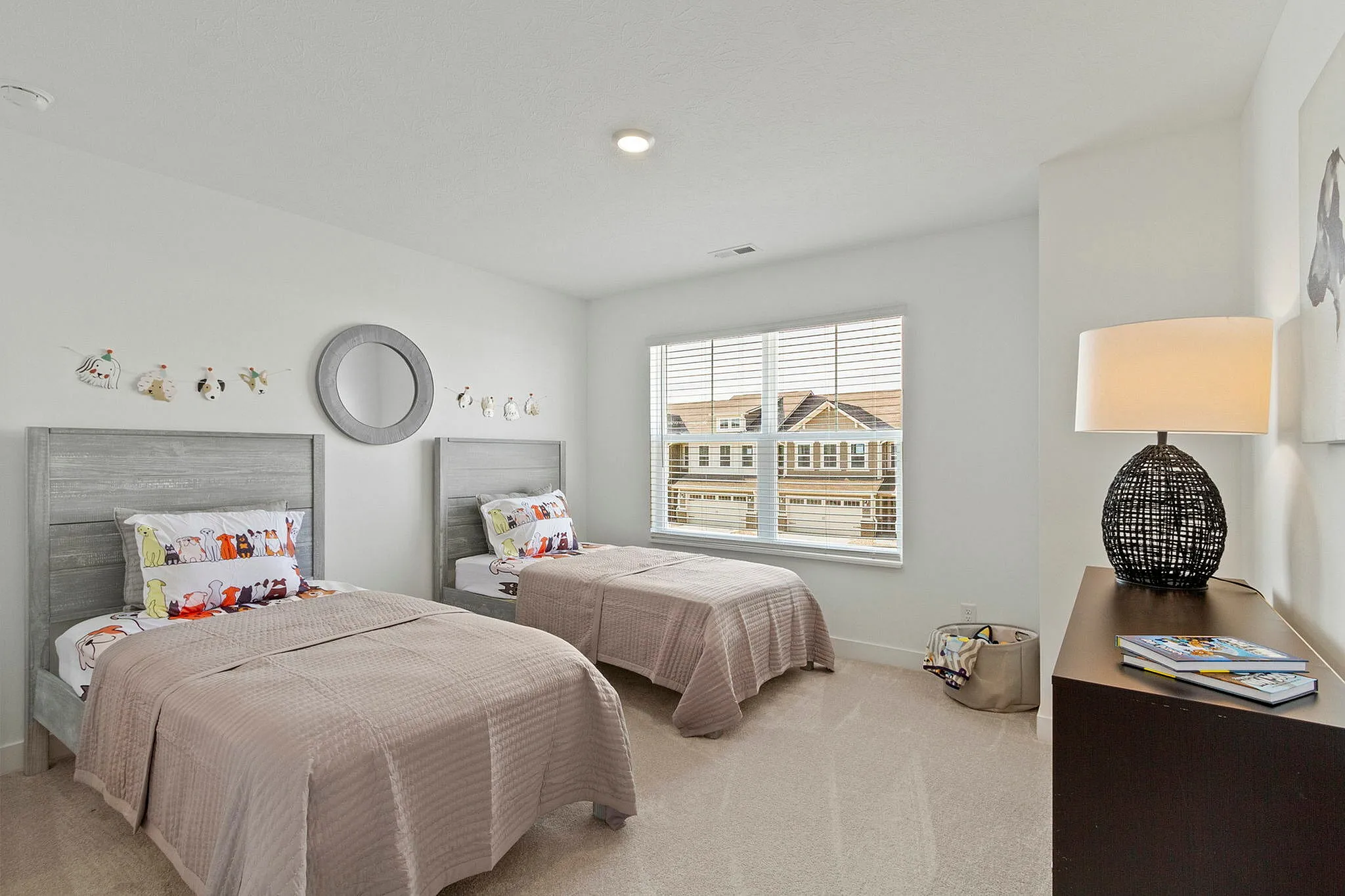 Guest bedroom with two twin beds and dresser