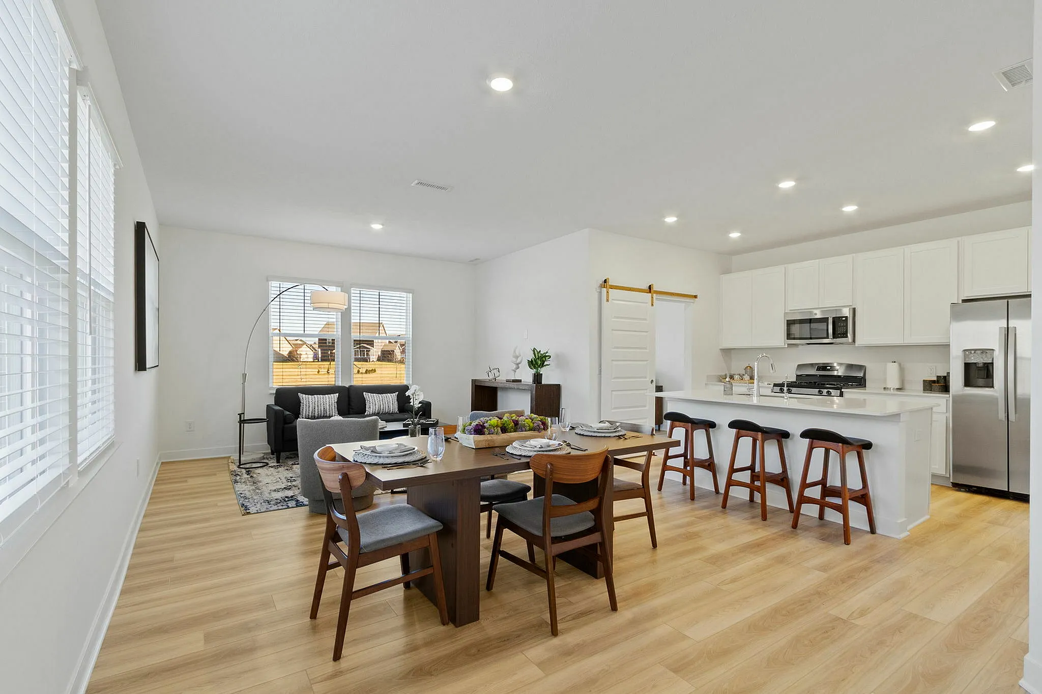 Furnished kitchen and living area open concept vaulted ceilings