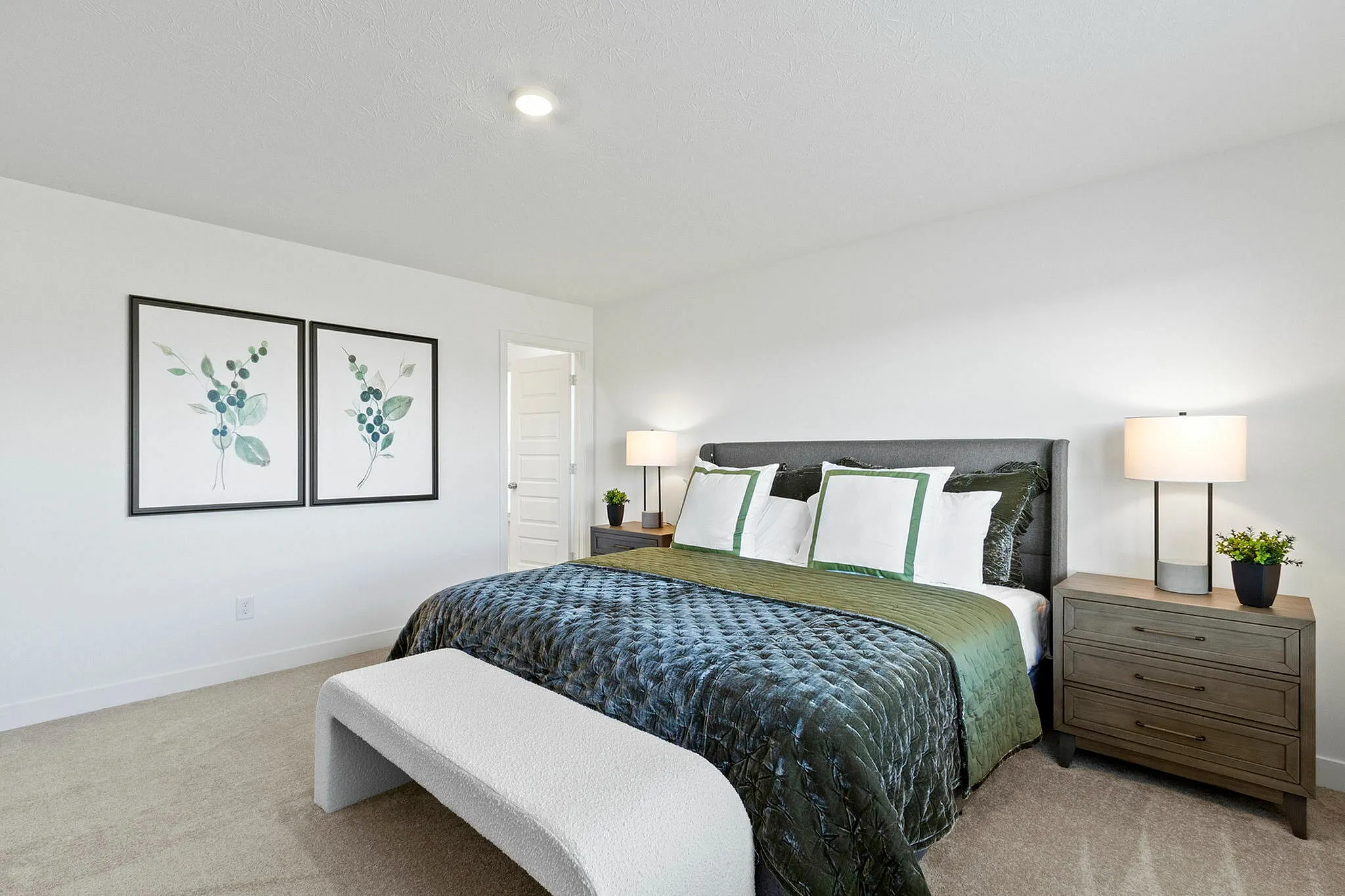 Furnished main bedroom with carpet