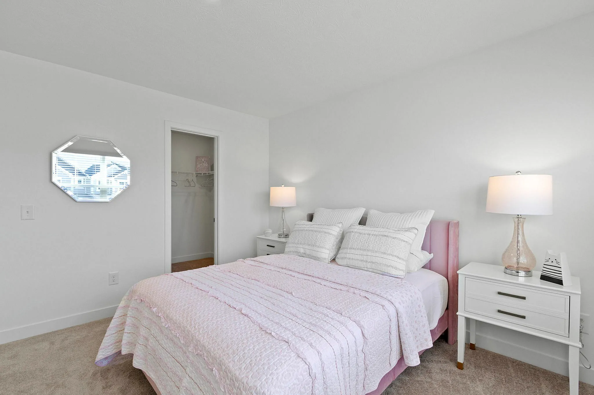 Furnished guest bedroom with closet