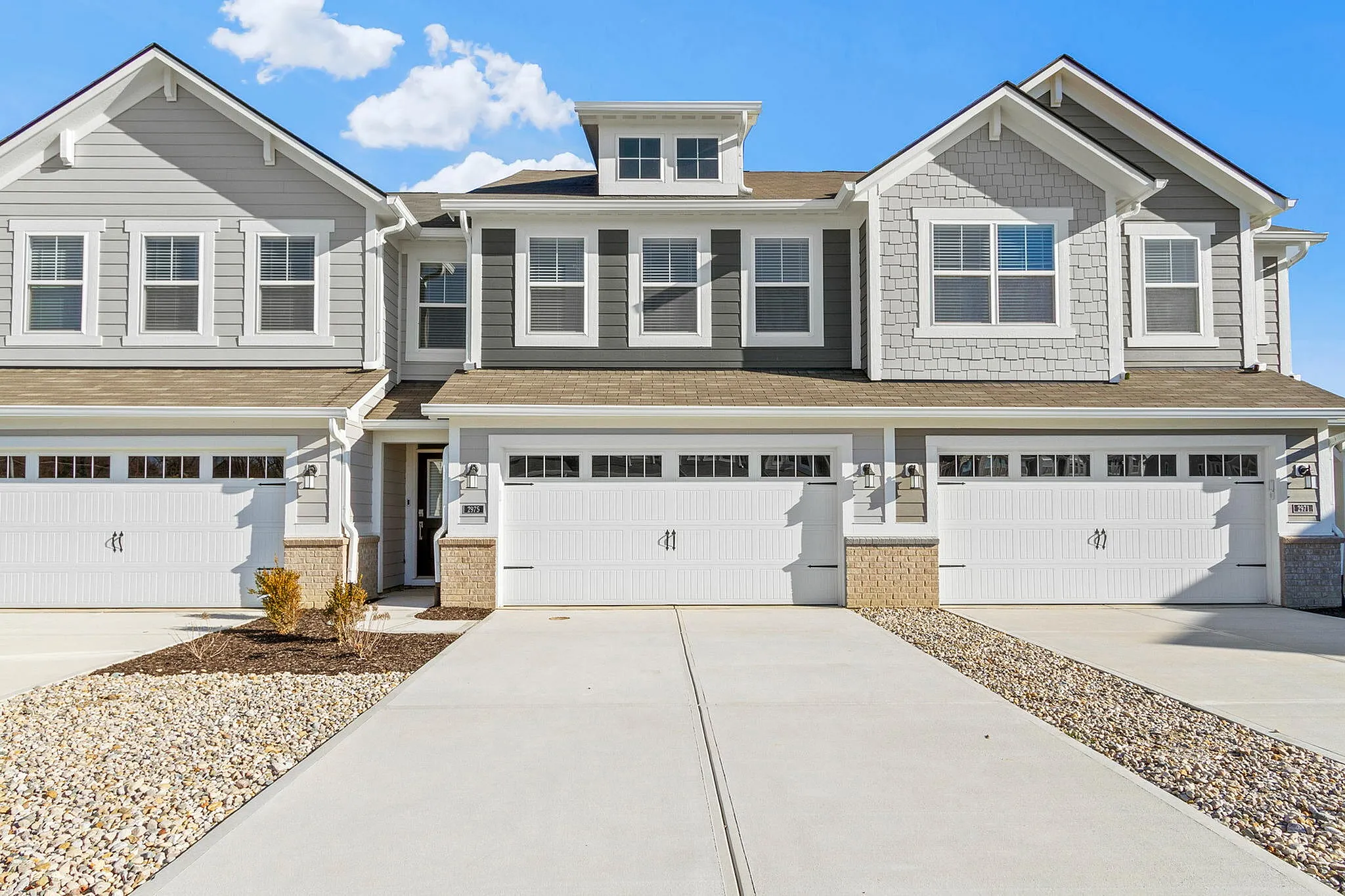 Townhomes With Attached Garage in Brownsburg, IN – Wynne Farms – Attached 2-Car Garage, Spacious Driveway With Ring Video Doorbell Pro.