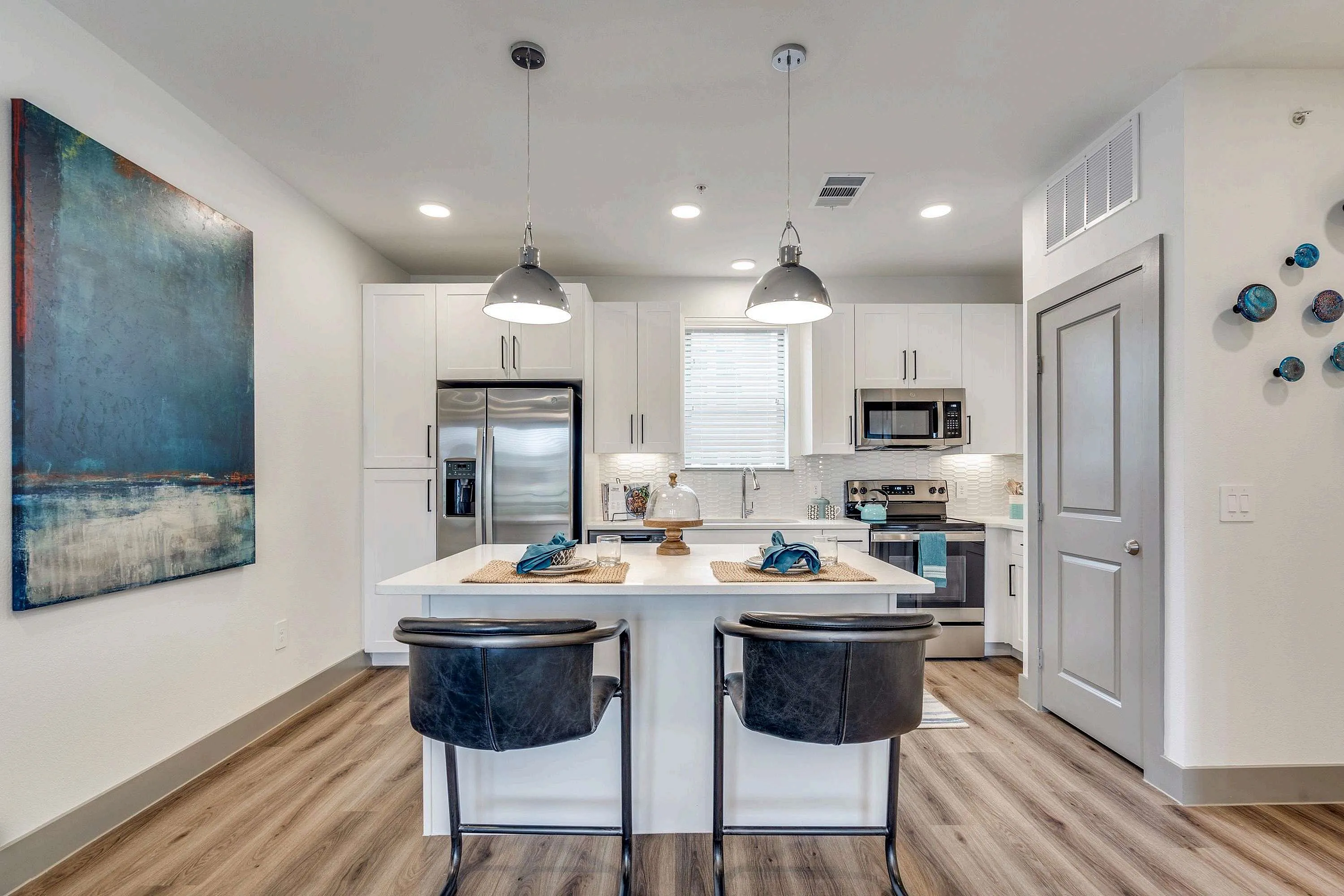 kitchen with stainless steel appliances and prep island