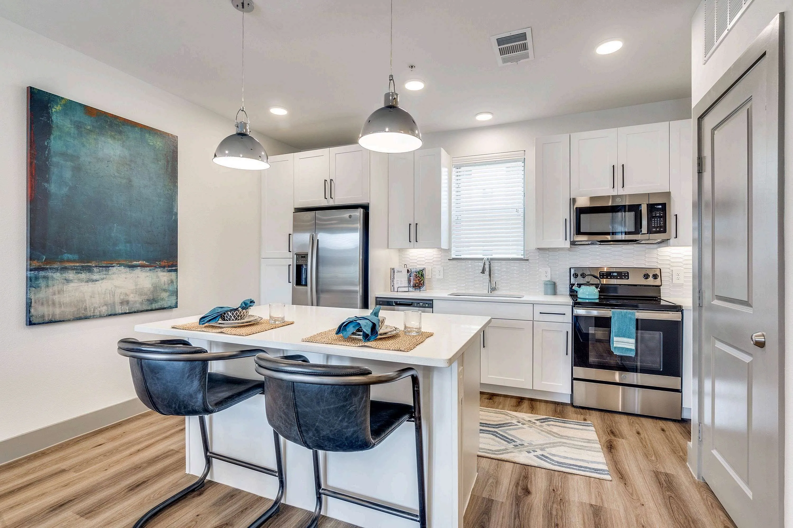 kitchen with stainless steel appliances and prep island