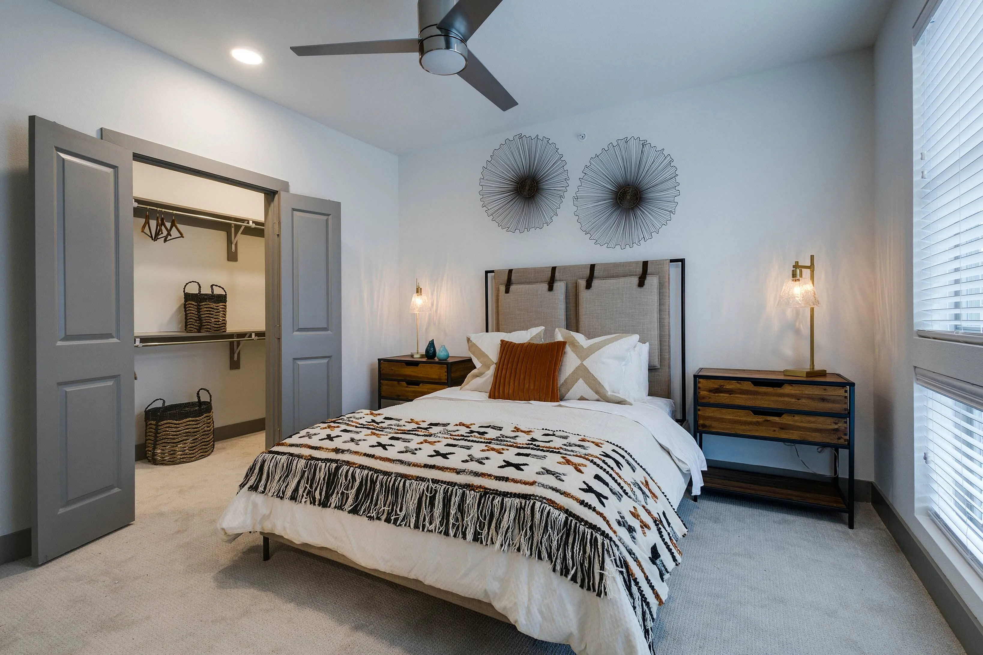 Stylish bedroom with carpet and walk in closet