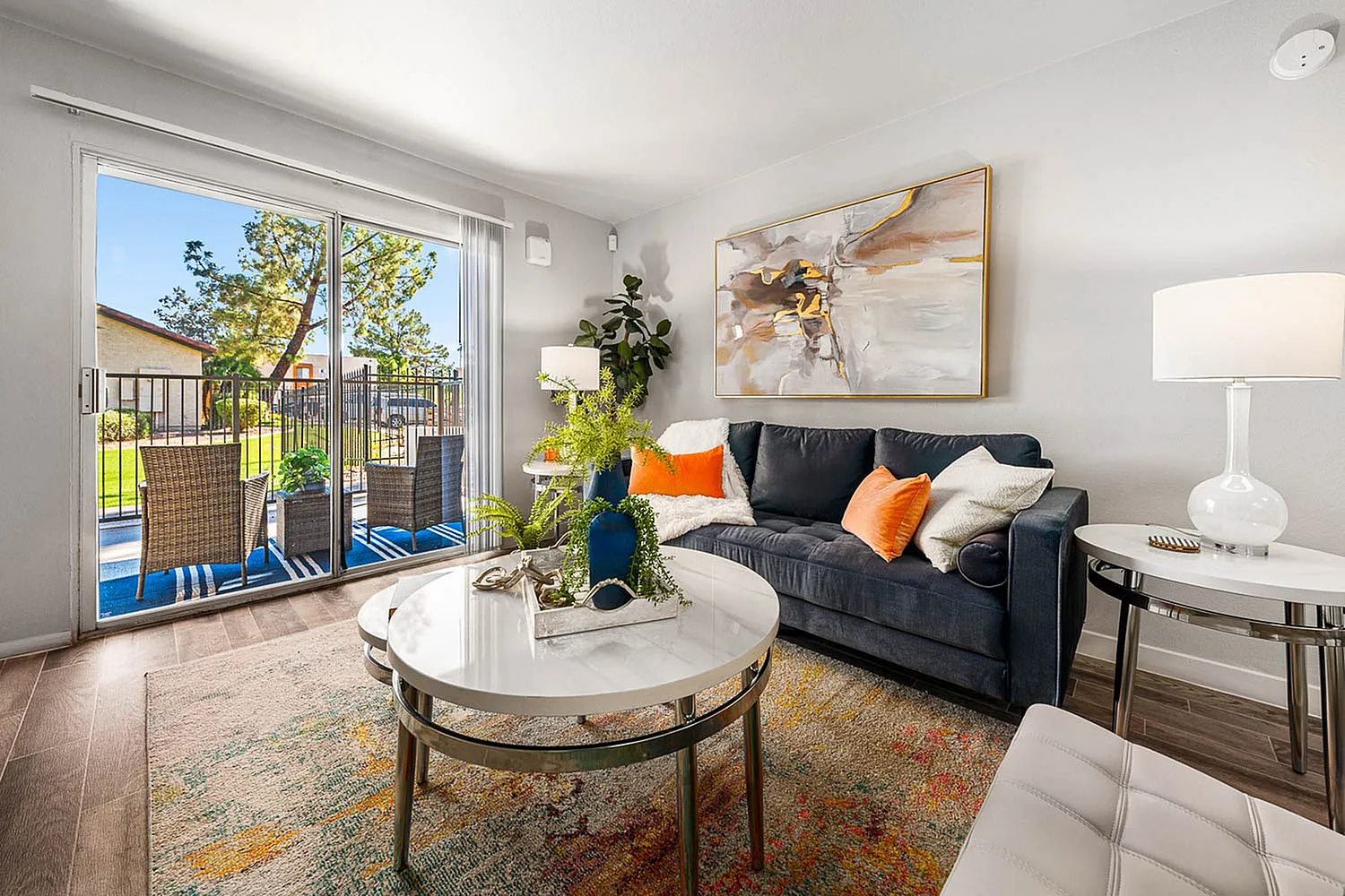 decorated living area sliding glass doors to back patio