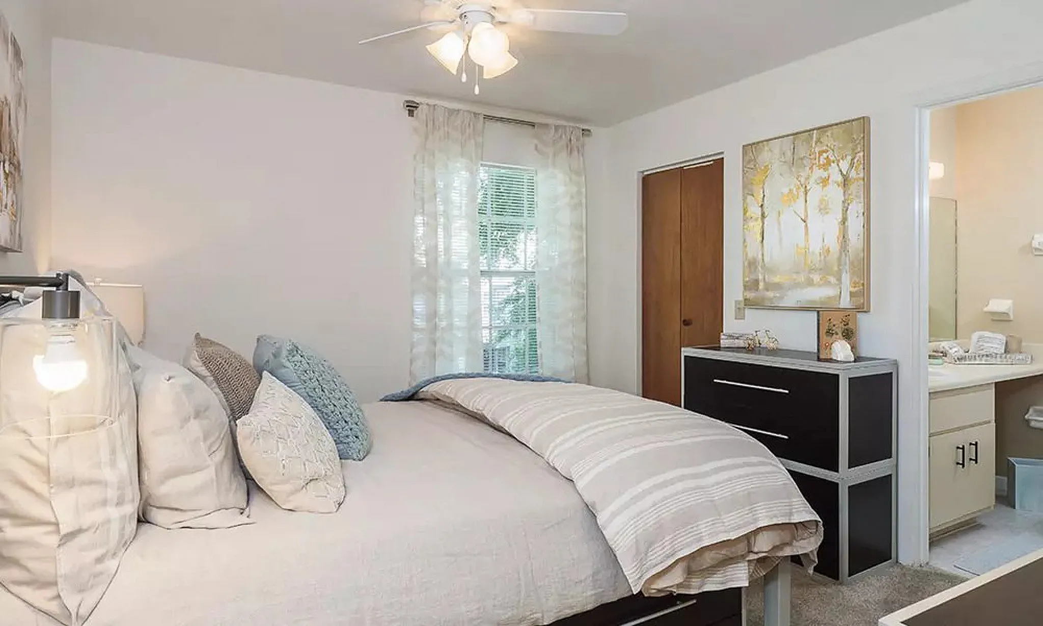 model home with bedroom and dresser