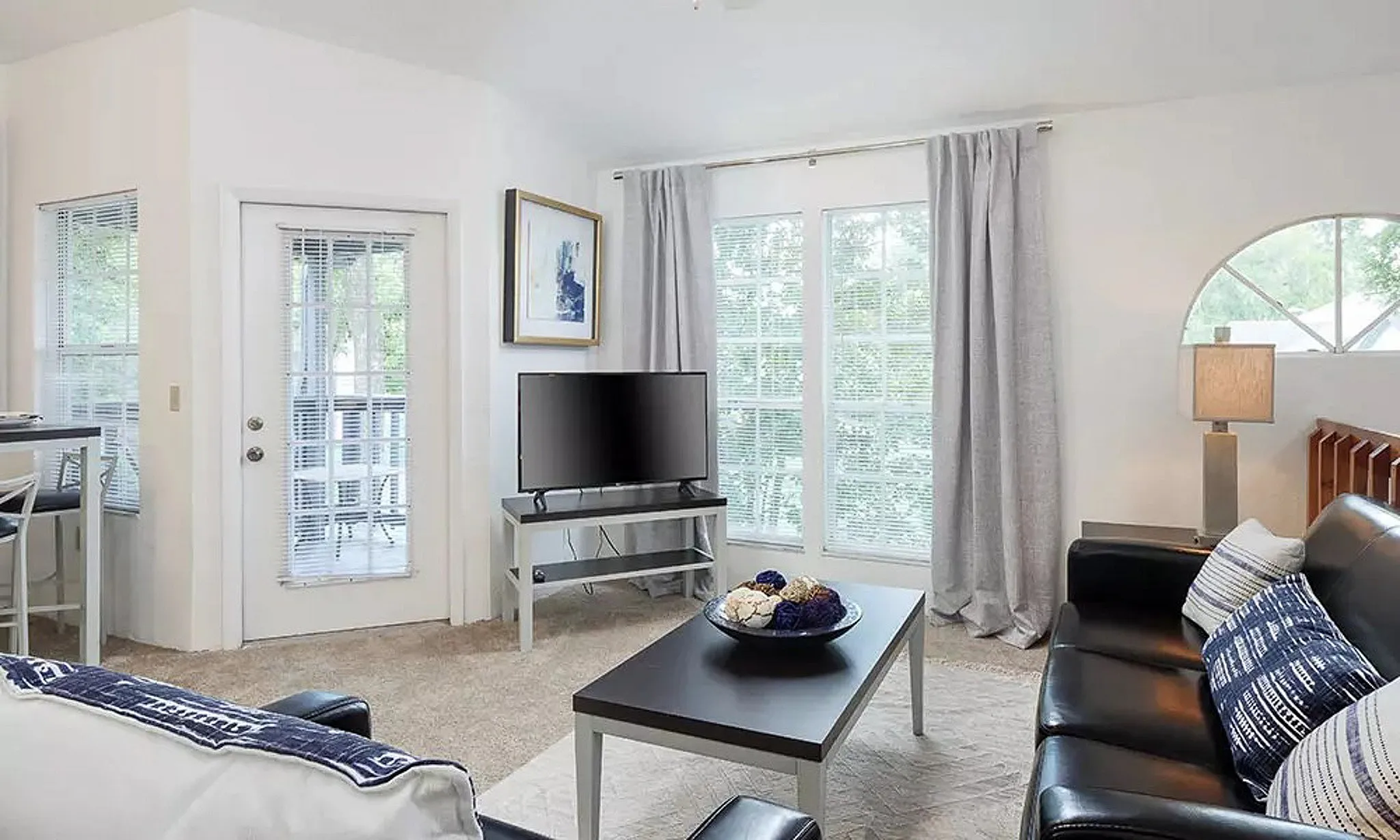 living room with tv and coffee table