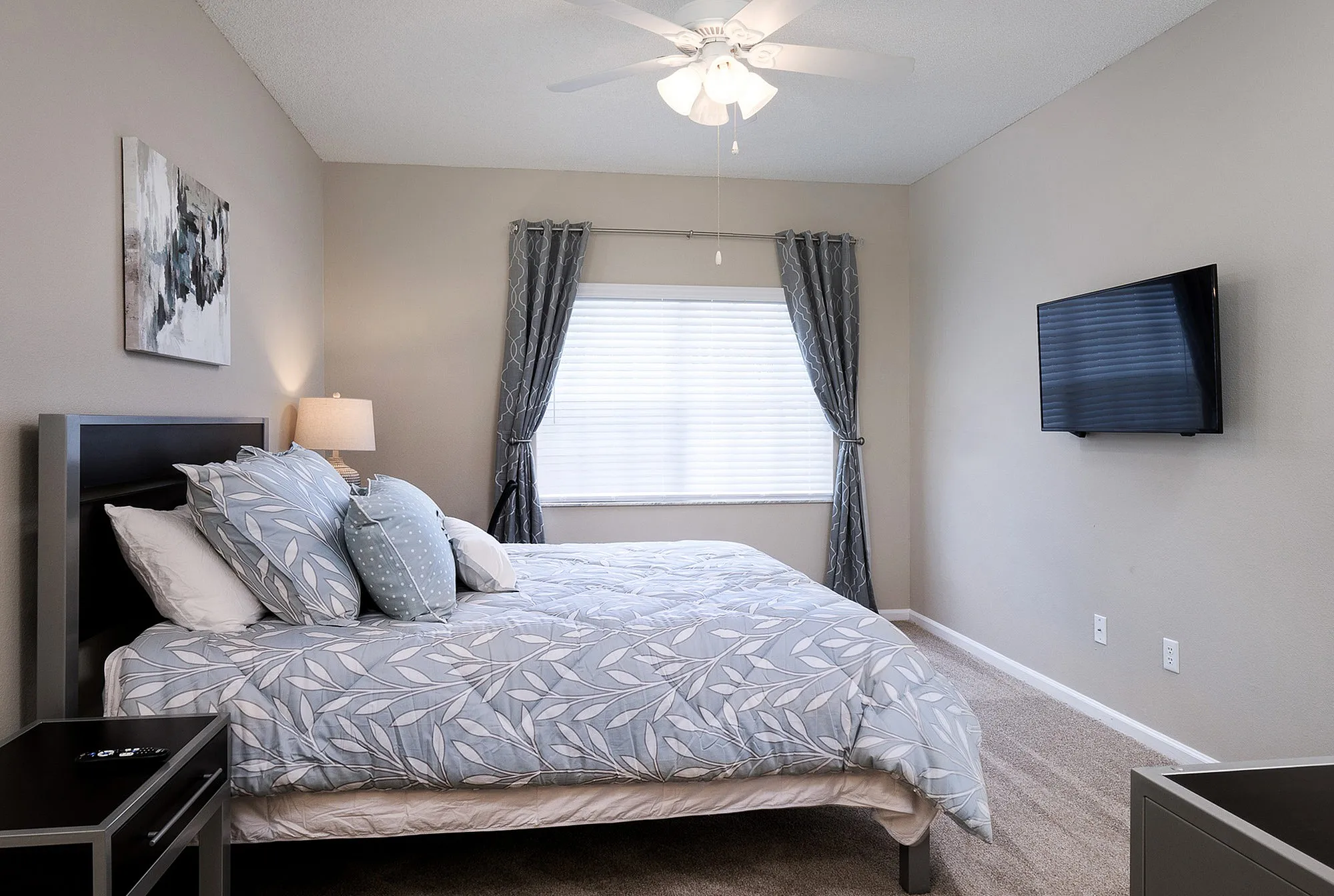 Guest bedroom with bed and TV
