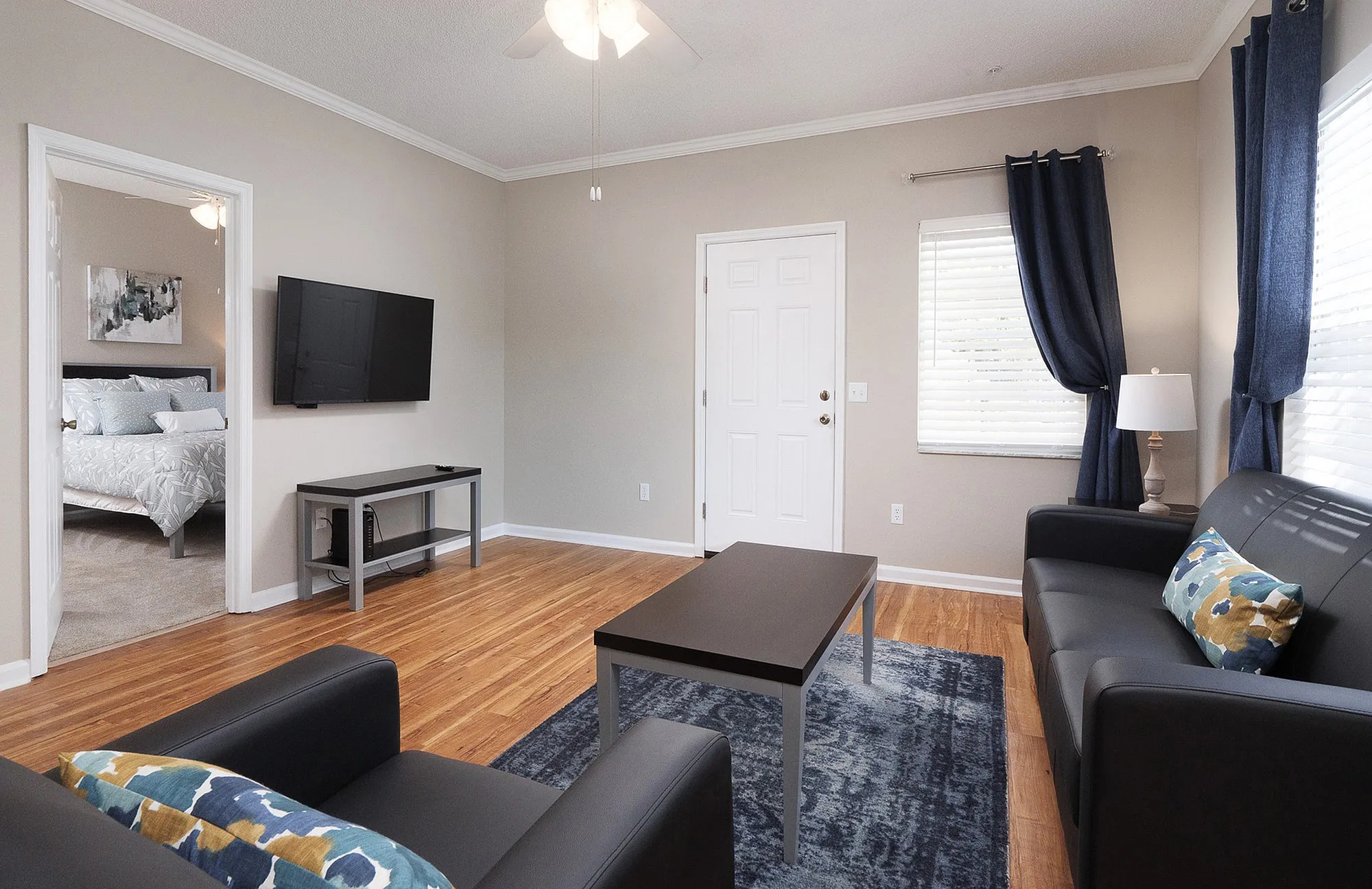 Living room looking into primary bedroom