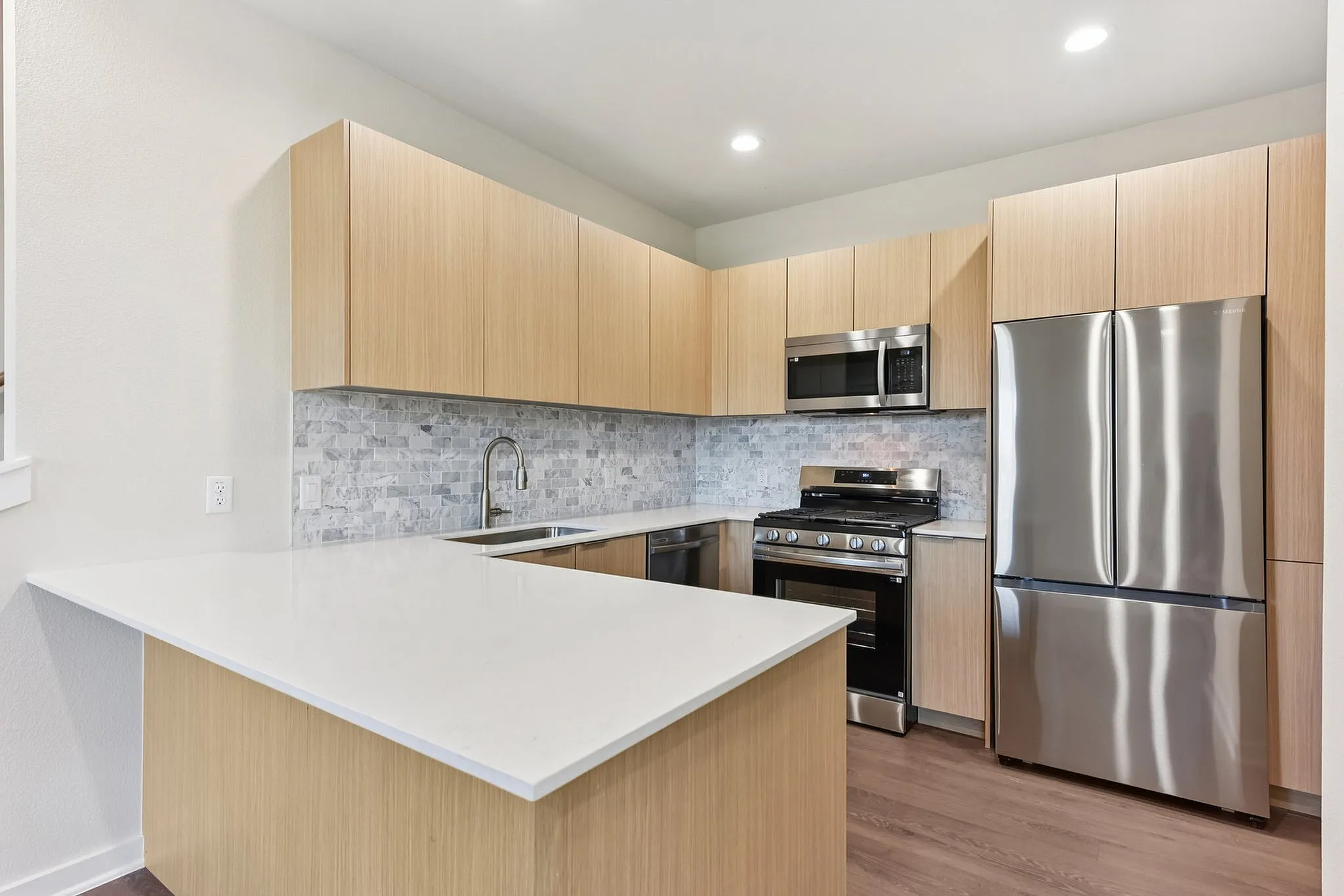 Kitchen with light wood cabinets