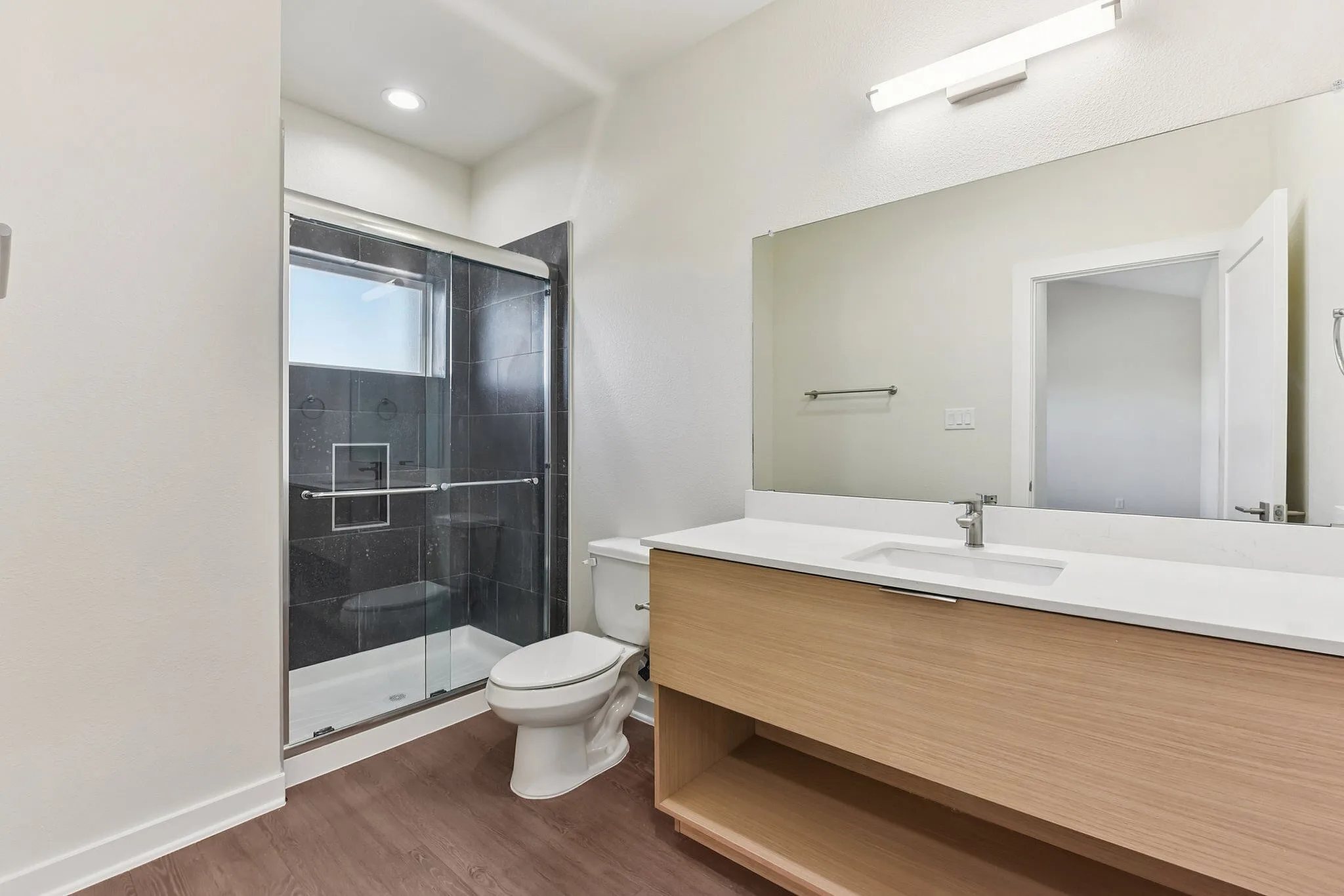 Bathroom with walk-in shower and large vanity