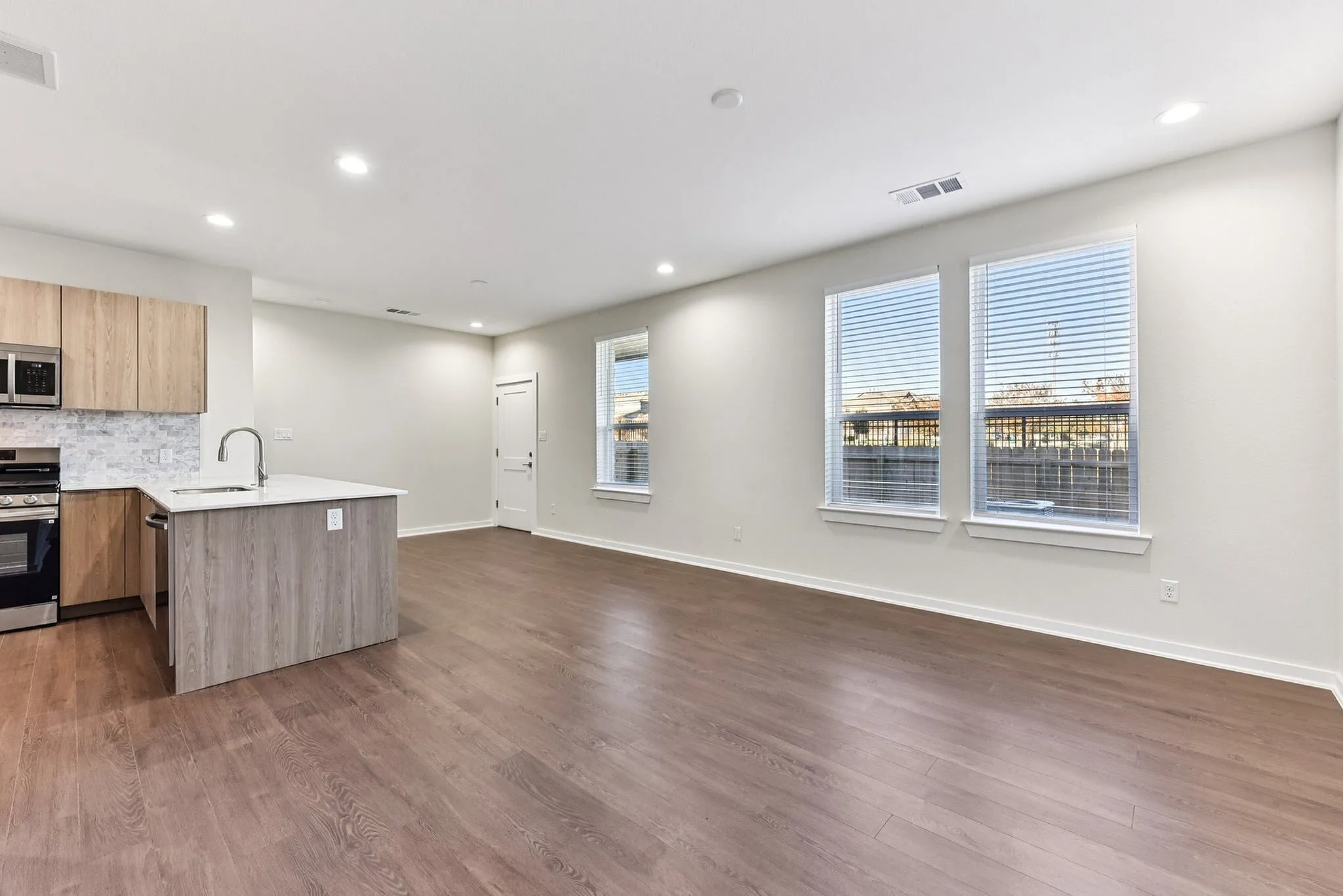 large living room with open kitchen