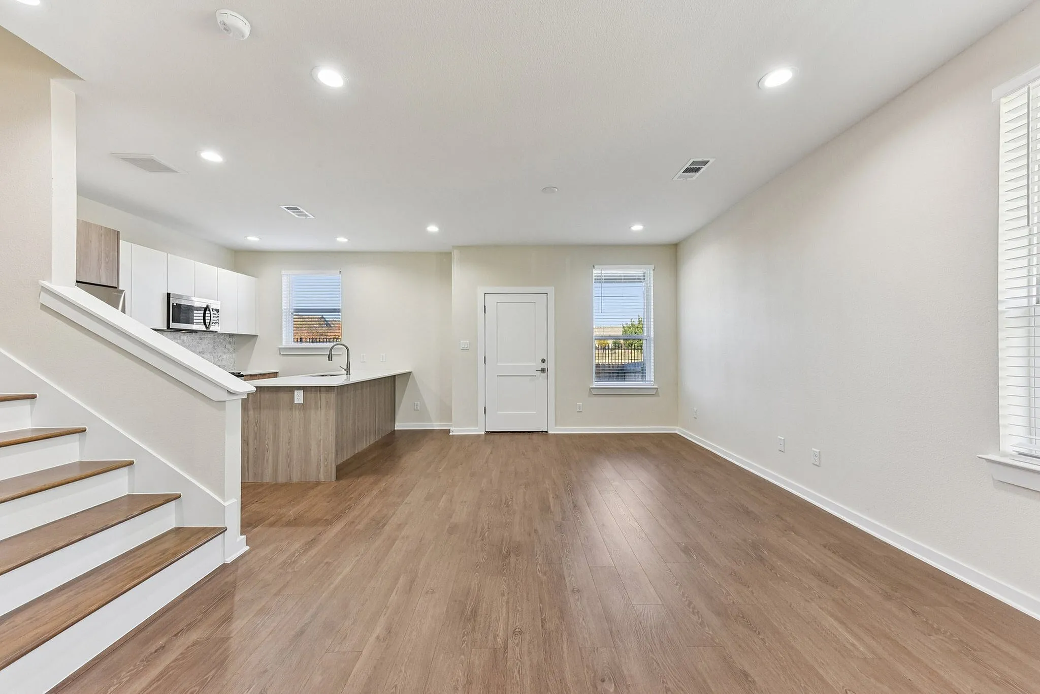 open living room with kitchen access