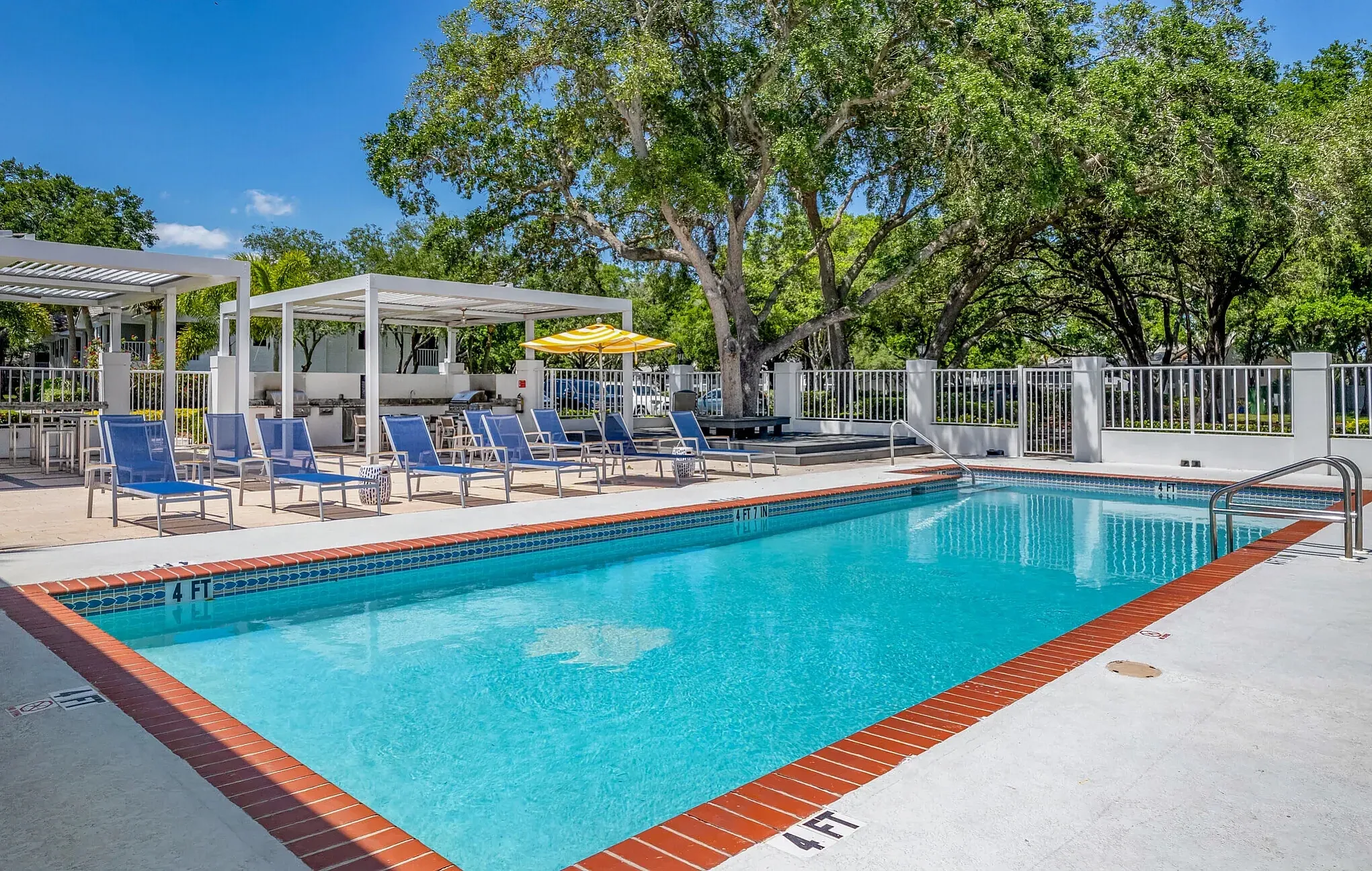 pool with lounge chairs and cabanas