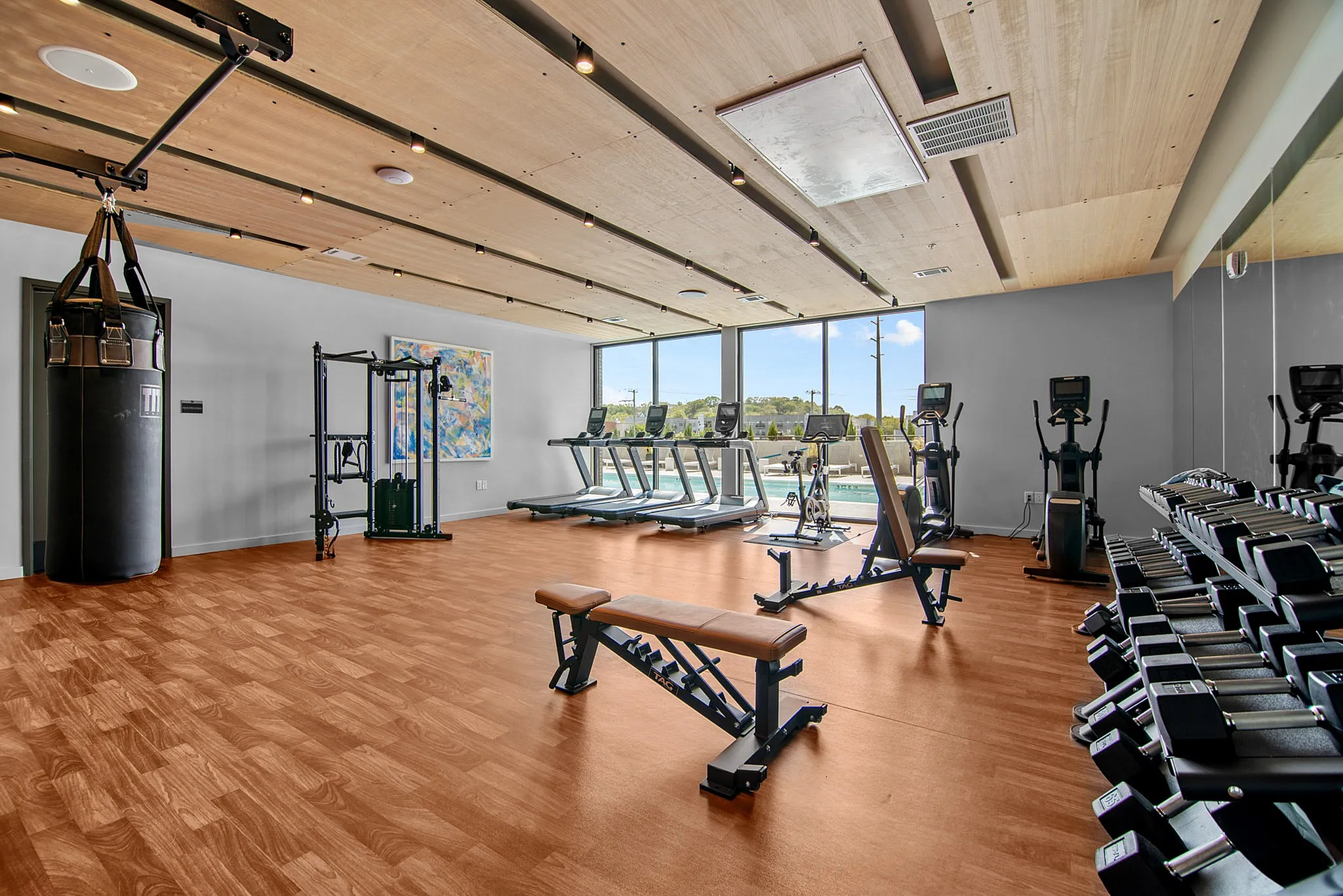 fitness center with free weights cardio and punching bag