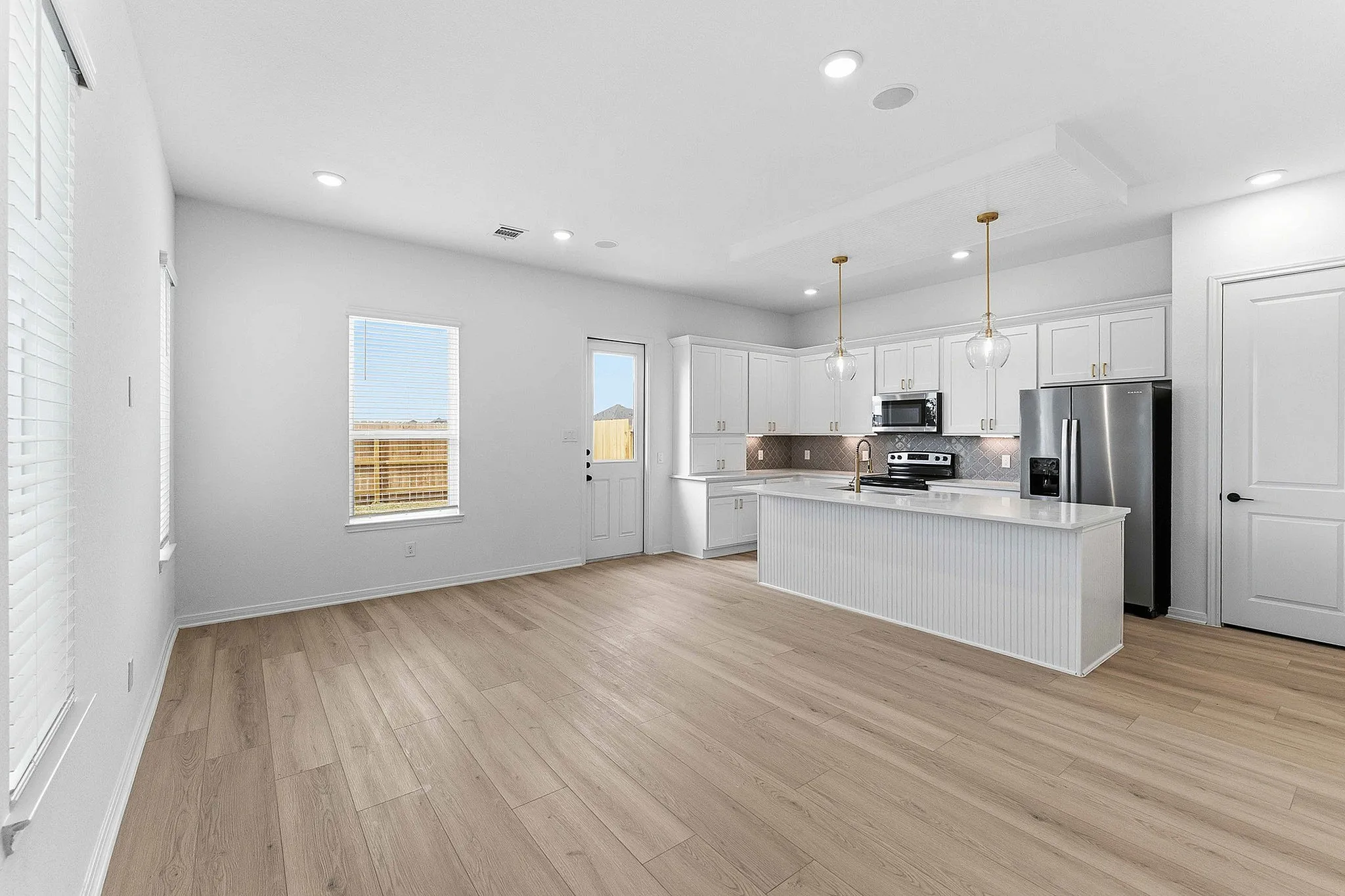 interior of kitchen with white cabinets