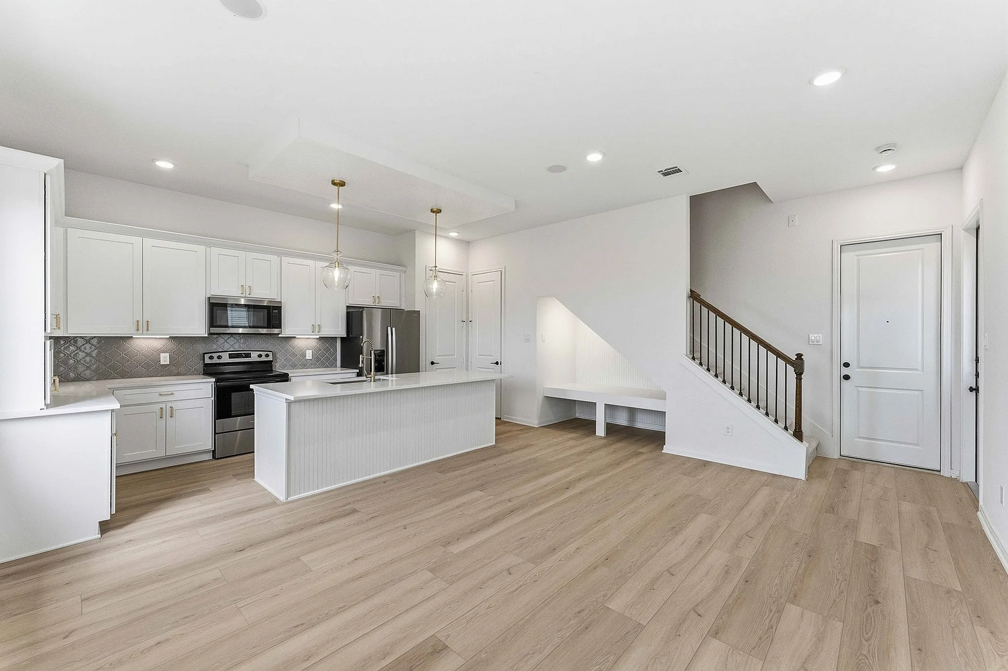 interior of kitchen with white cabinets