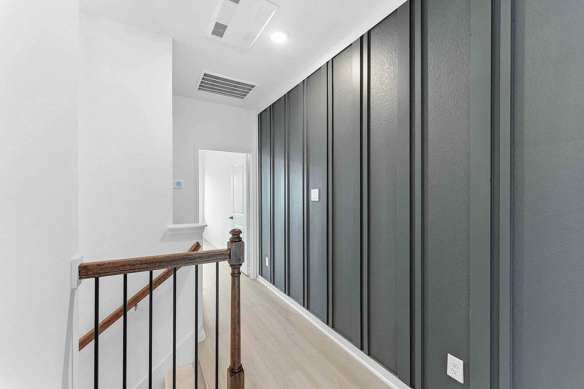 hallway with accent wall