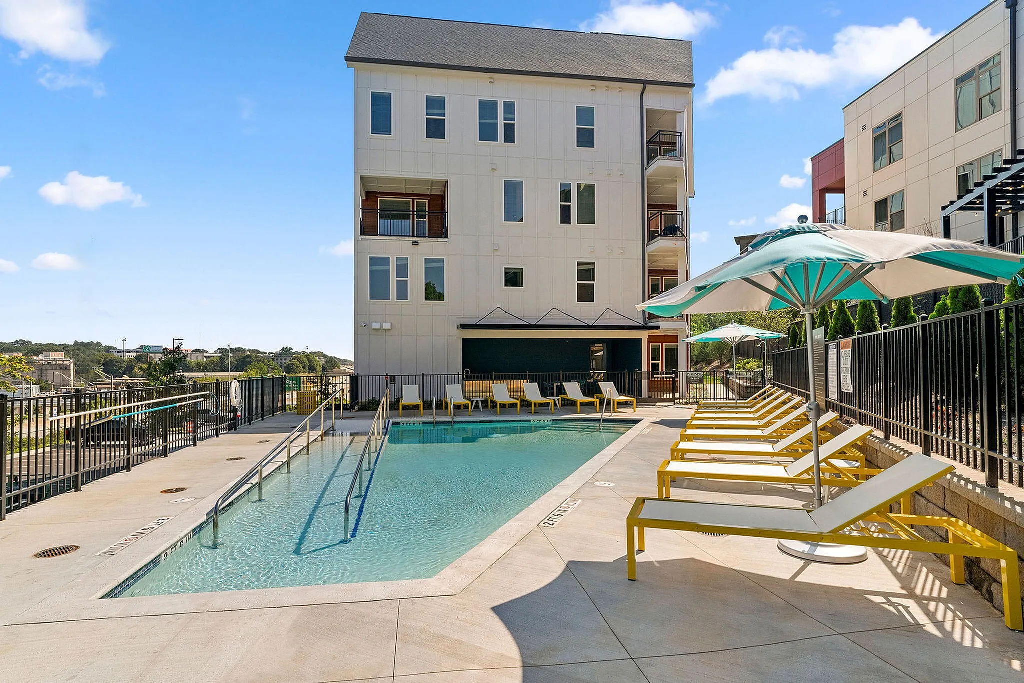 community pool with lounge chairs