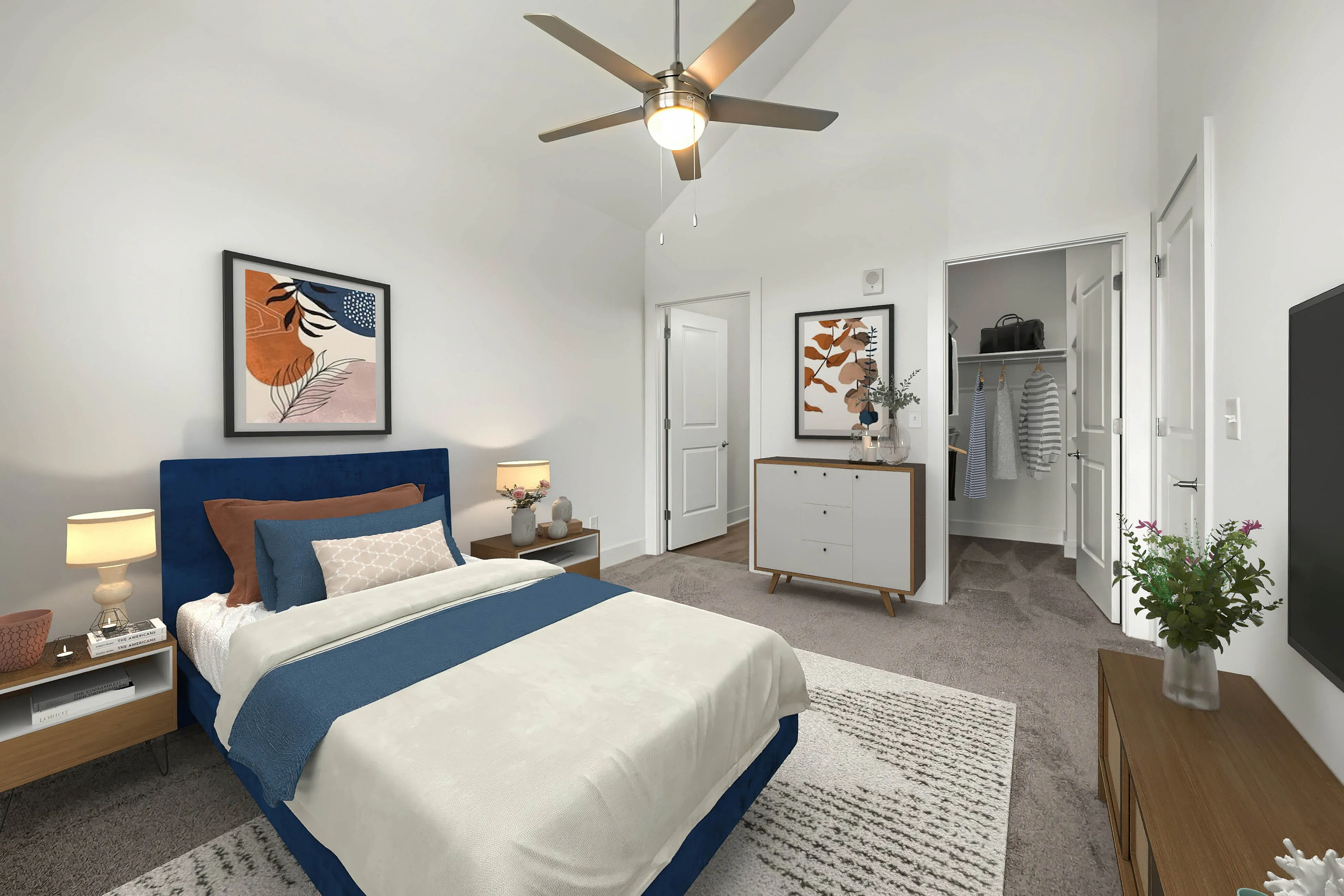 guest bedroom with carpet and ceiling fans