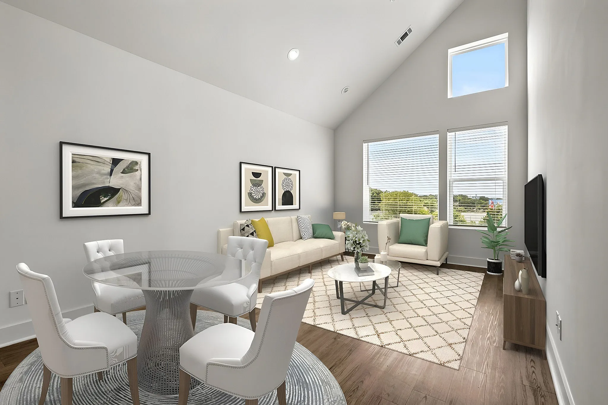 living and dining rooms with vaulted ceilings