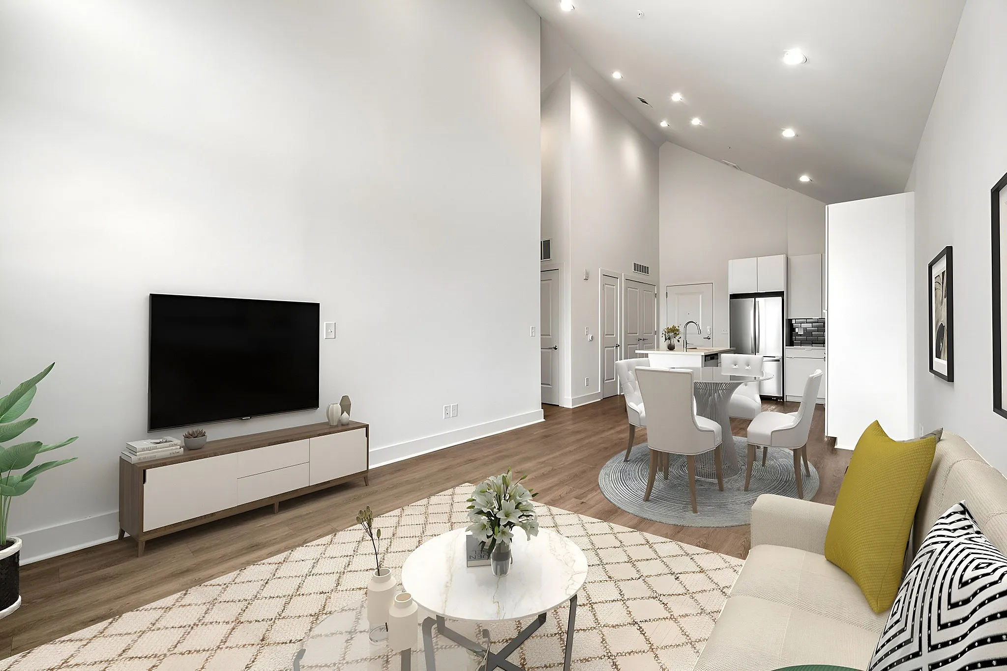 open concept living area with vaulted ceiling