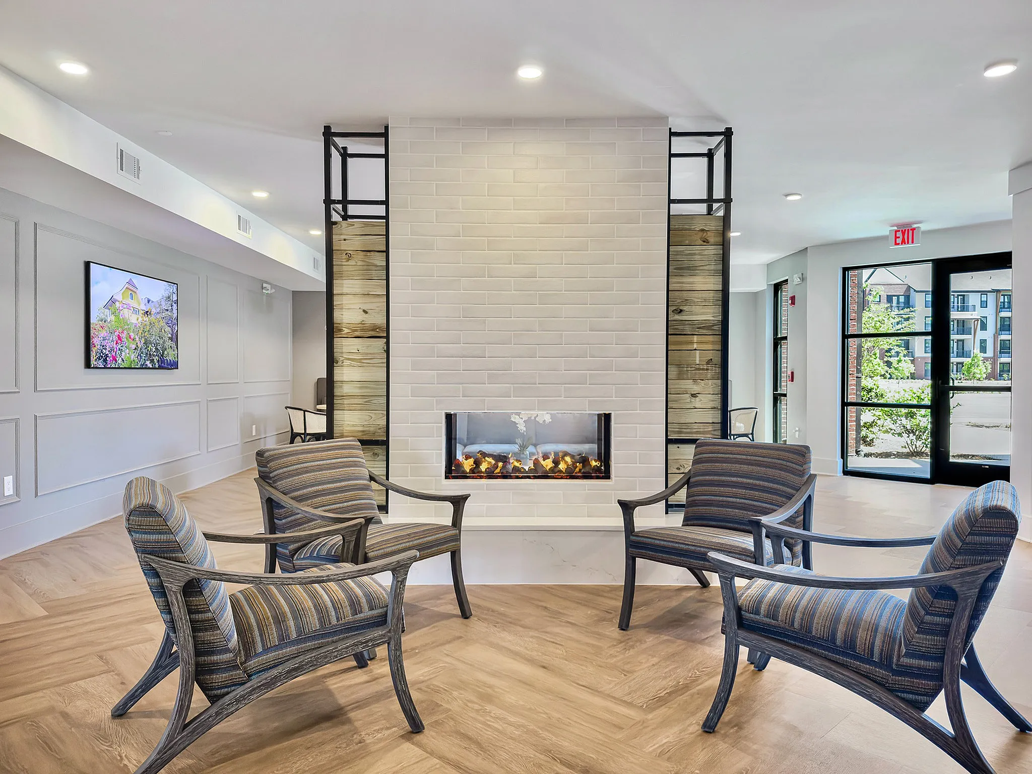 clubroom with fire place and tv with seating
