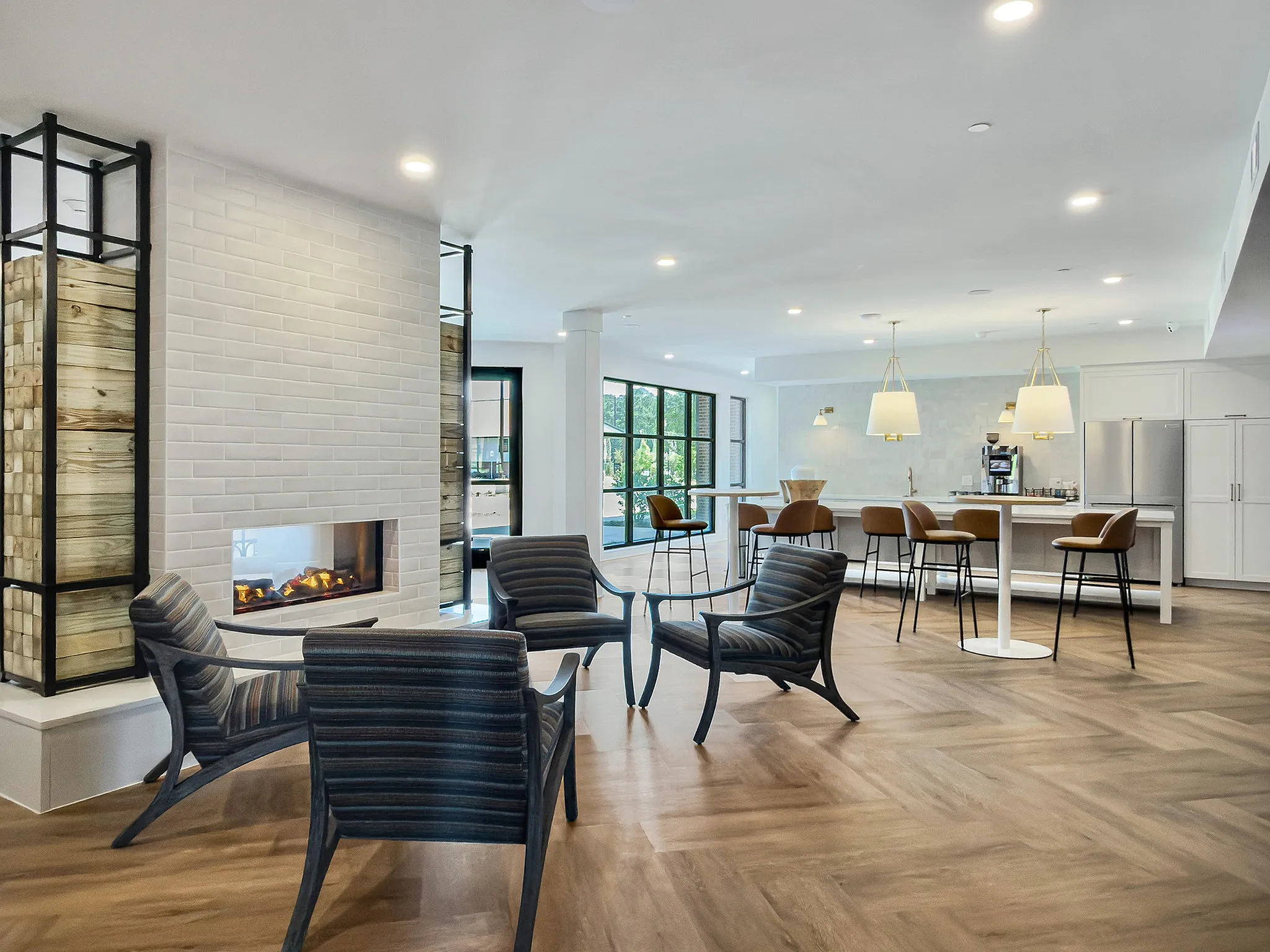 clubroom with fireplace and bar seating