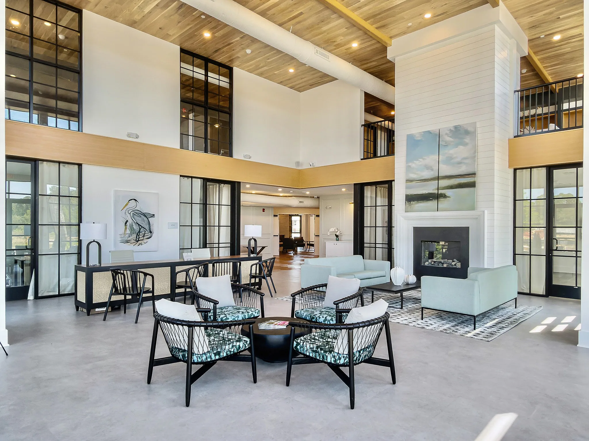 clubhouse with large windows and natural lighting with seating