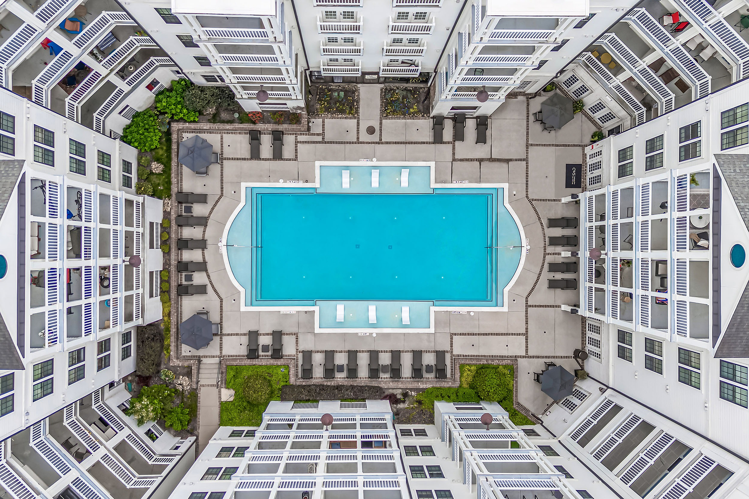 Drone of the swimming pool with sundeck and lounge chairs