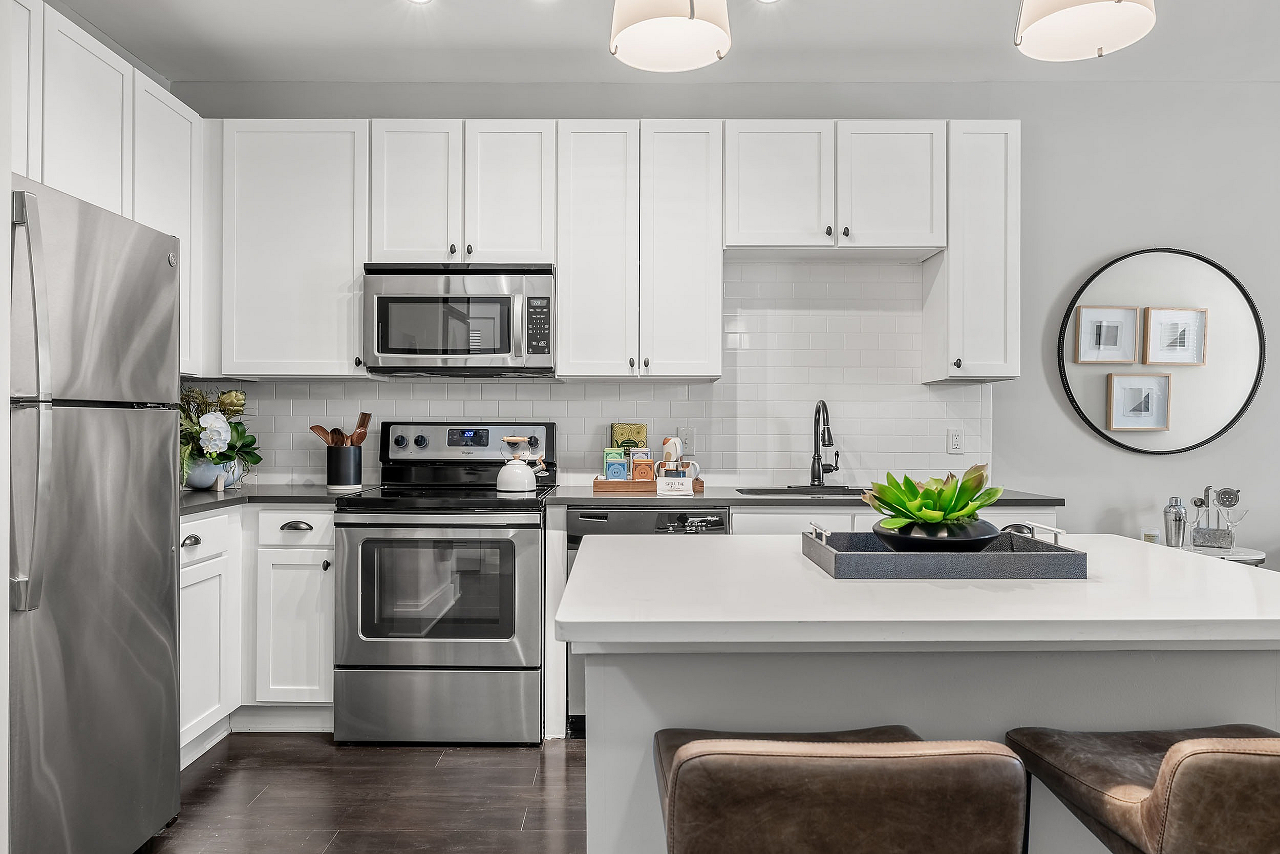 Kitchens at The Jane with white cabinets and large island