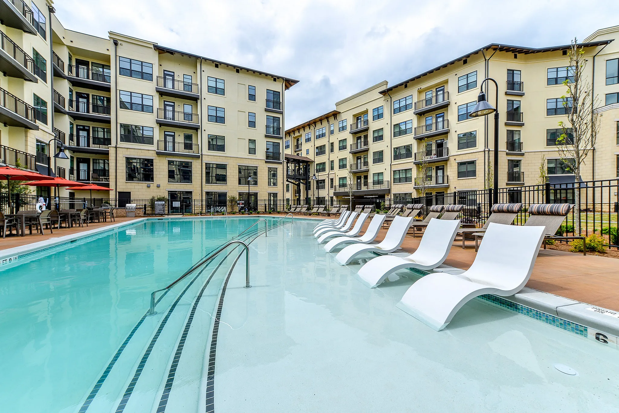 Swimming pool with tanning deck